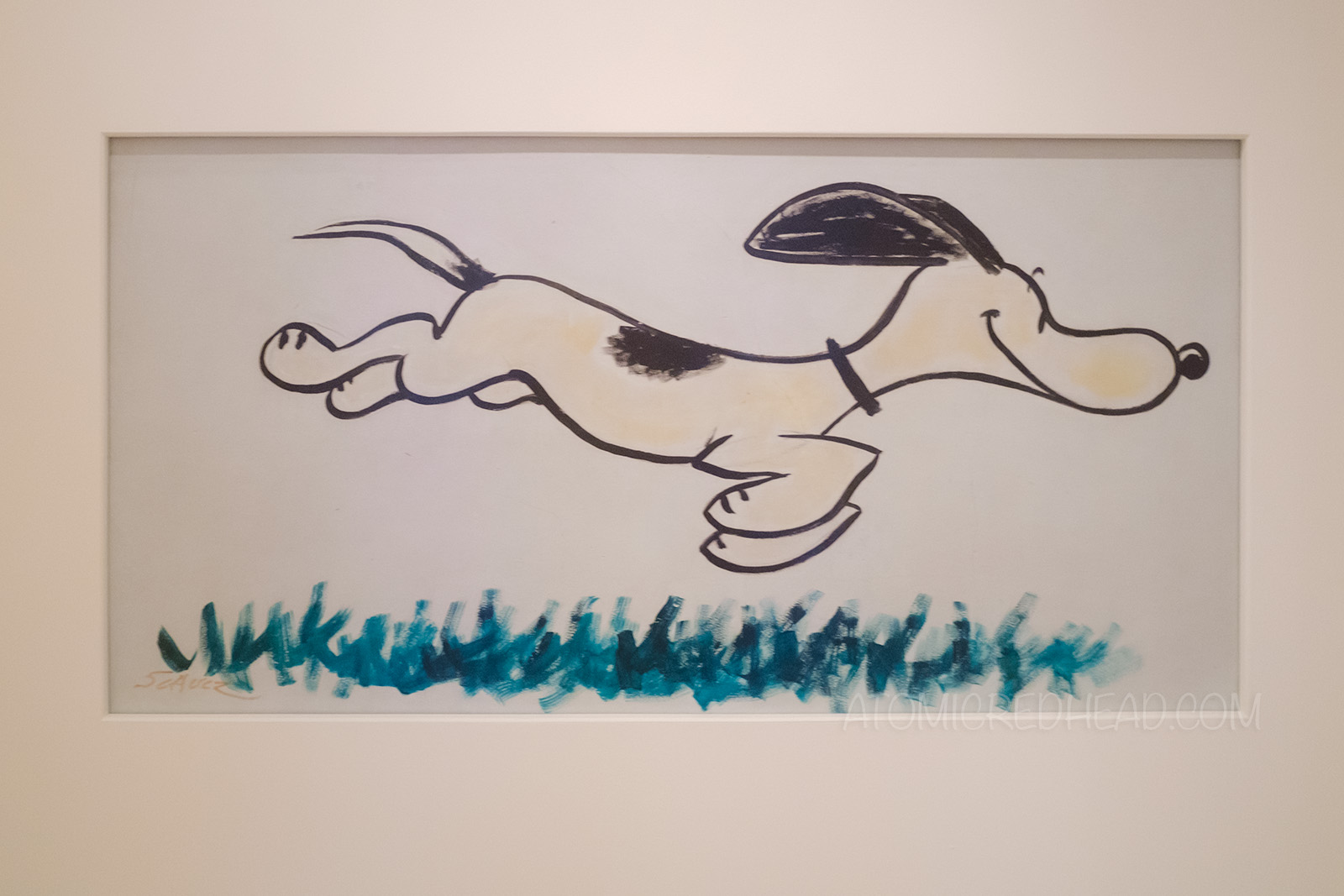 A mural of Snoopy running.