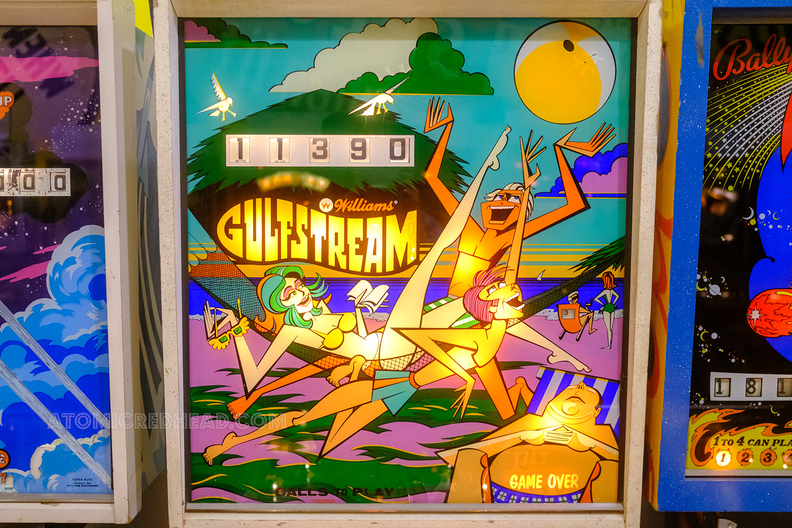 A bold graphic almost abstract blackglass for Gulfstream which features people in beach attire playing with a beach ball.