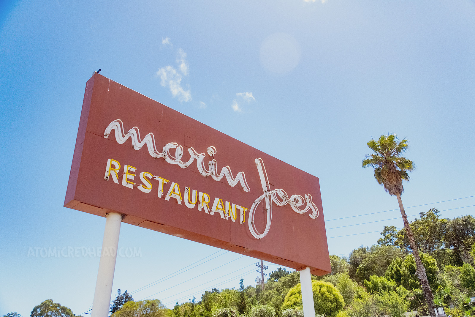 A large red sign reads "Marin Joe's Restaurant" in neon. 