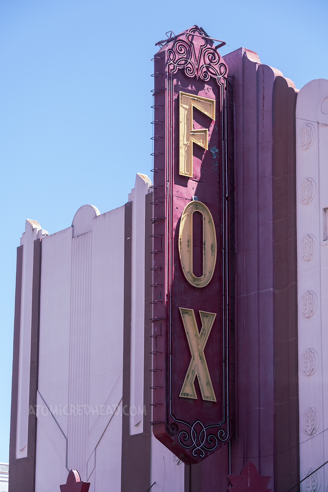 A large blade style neon sign reads "FOX" in yellow letters.
