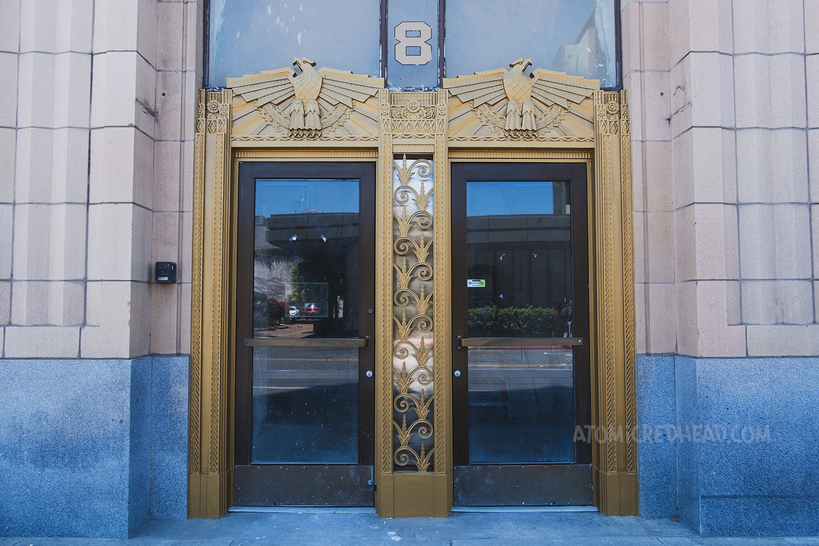 Art Deco eagles top two doorways.