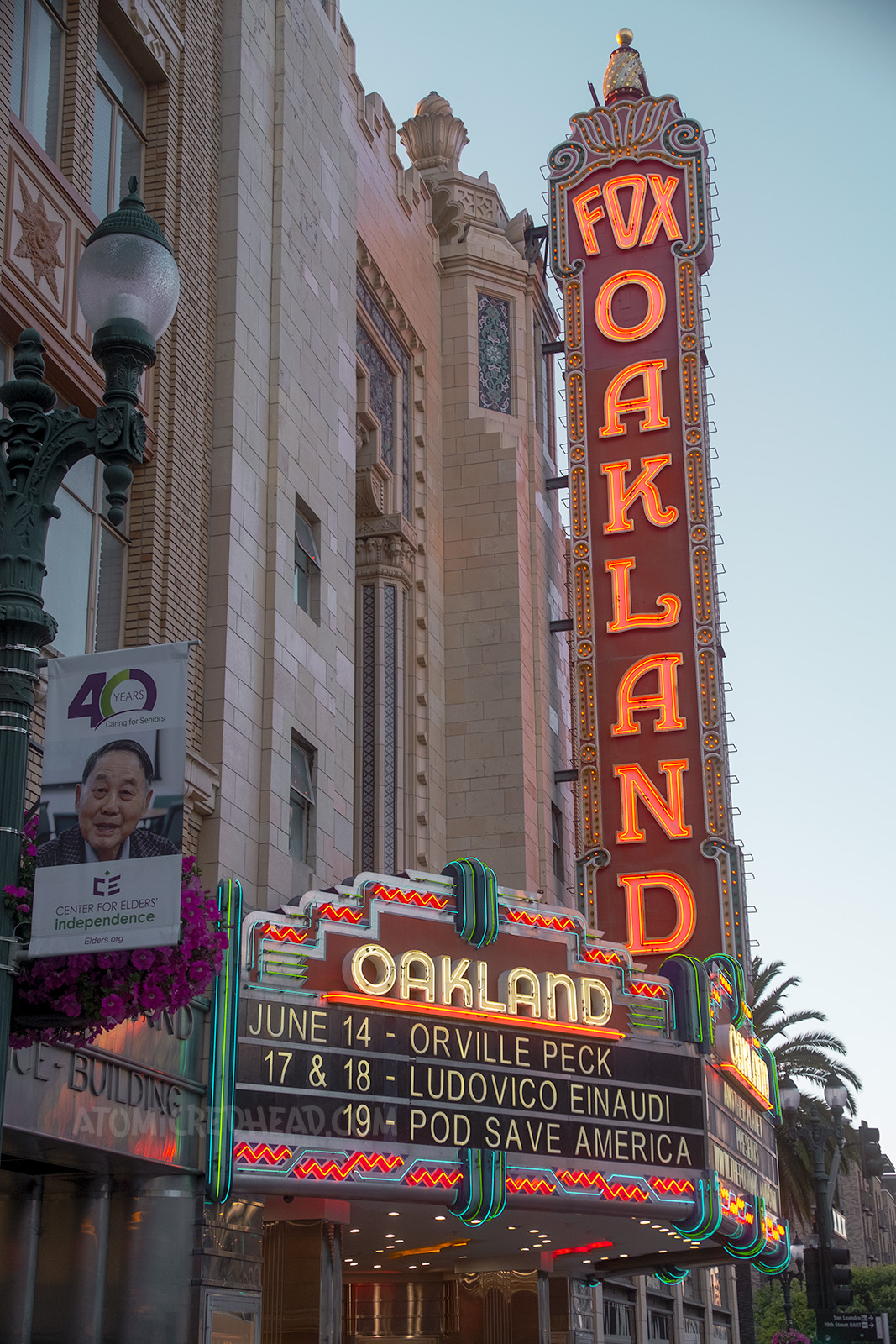 The large blade neon sign for the Fox Theatre which reads "Fox Oakland" and below the marquee reads "Oakland" in neon and below "June 14 Orville Peck 17 & 18 Ludovico Einaudi 19 Pod Save America"