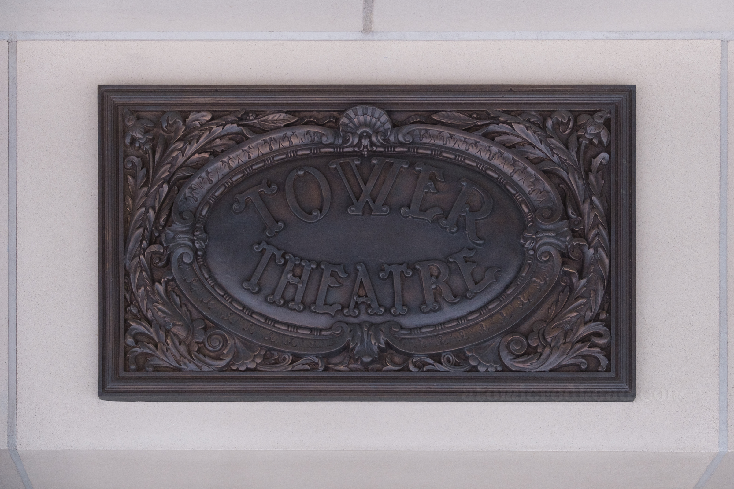 Ornate sign that reads "Tower Theatre"
