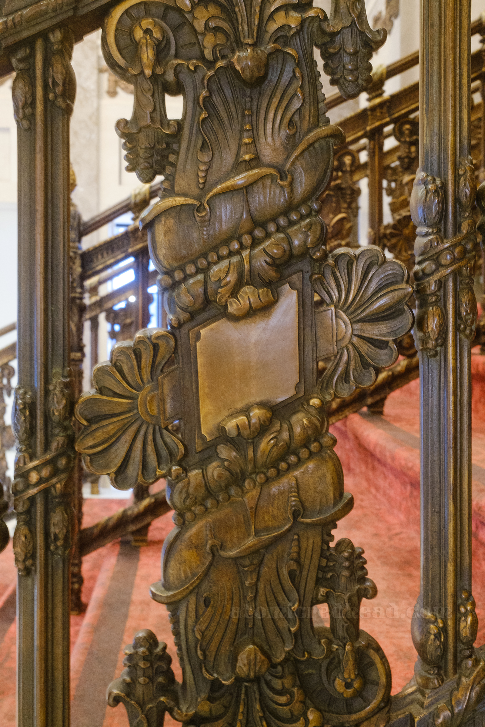 Close-up of the swirling brass railings.