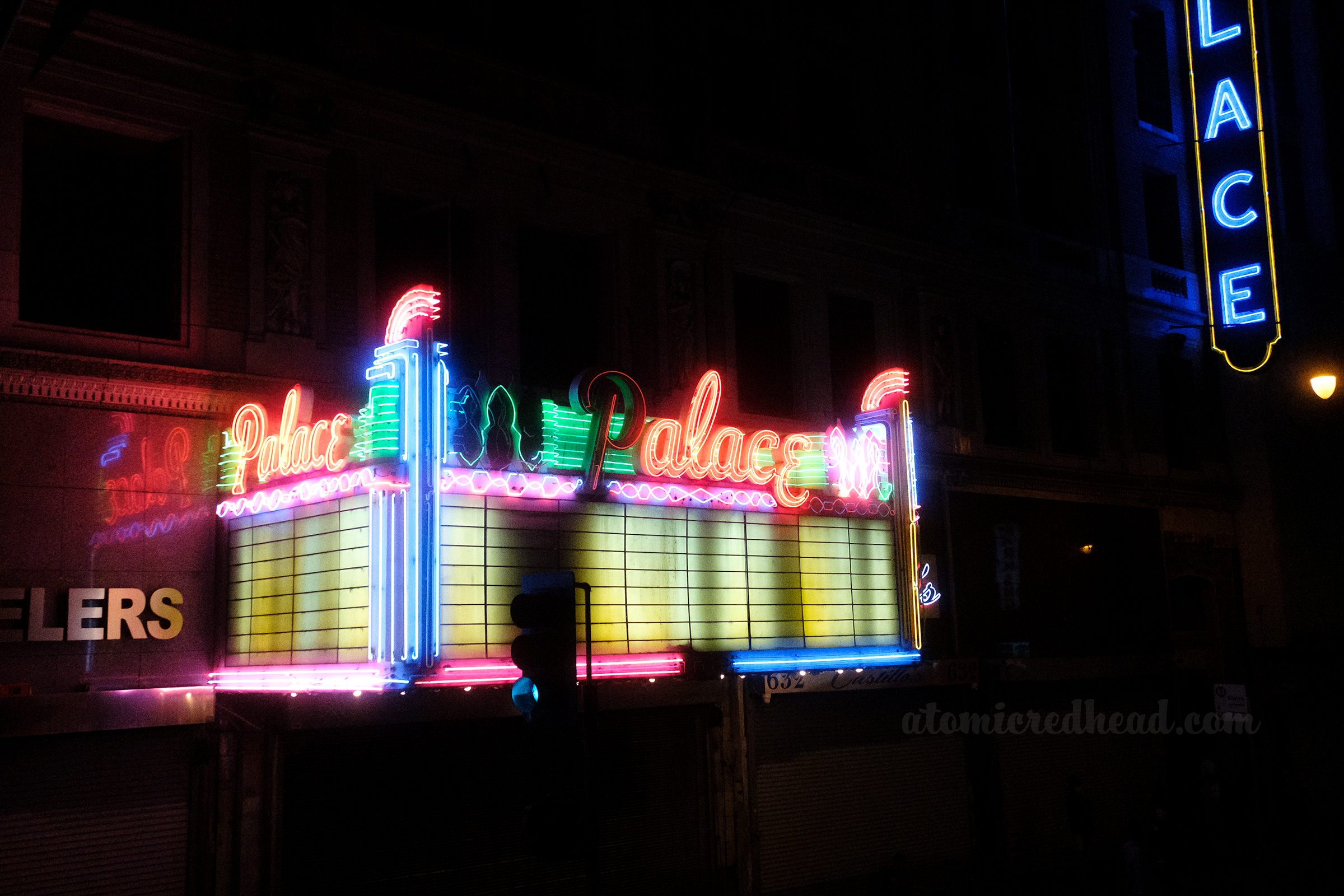 The Palace marquee, which reads "Palace" on three sides with some letters lit.