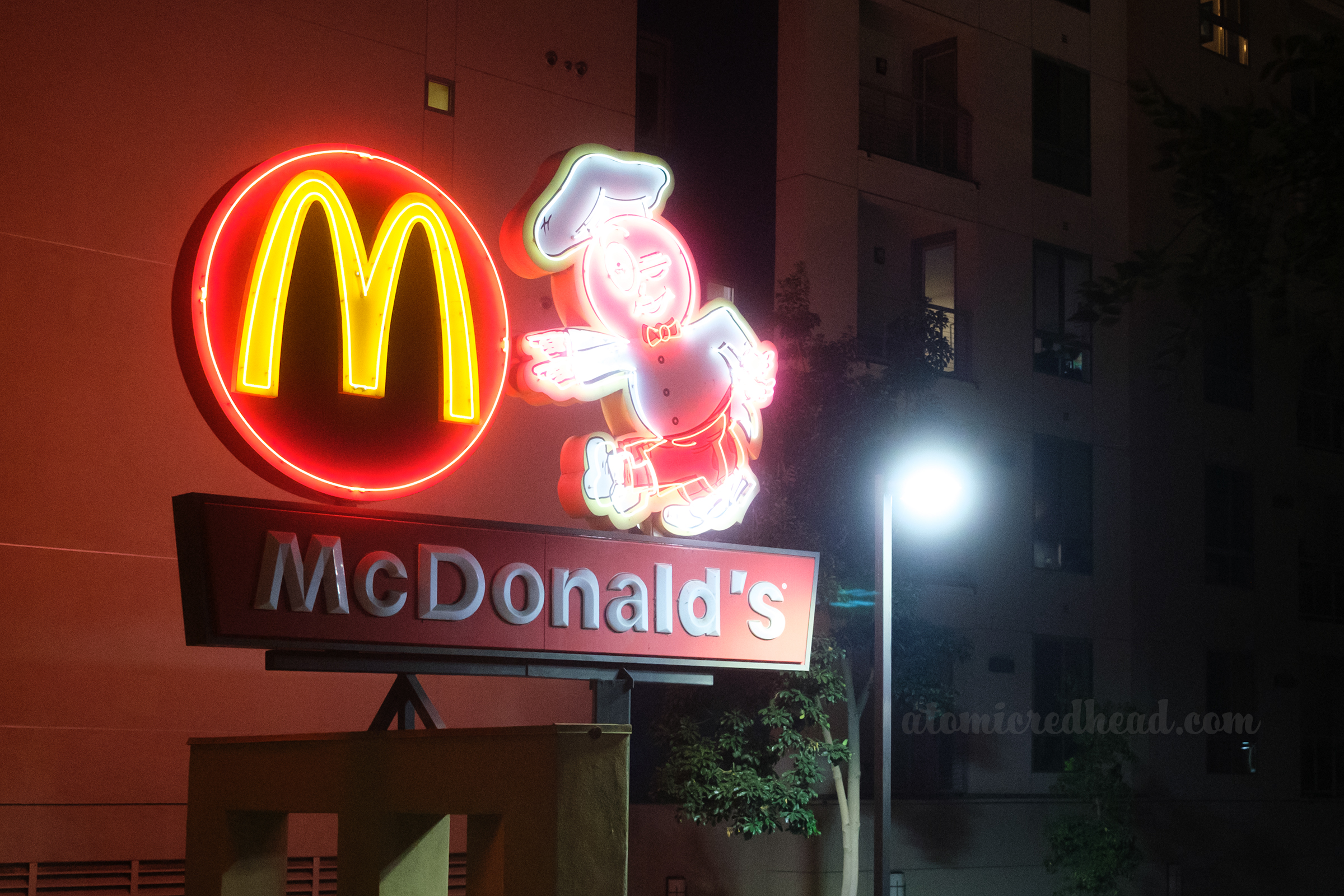 A newer McDonald's features a neon arches logo and "Speedee" 