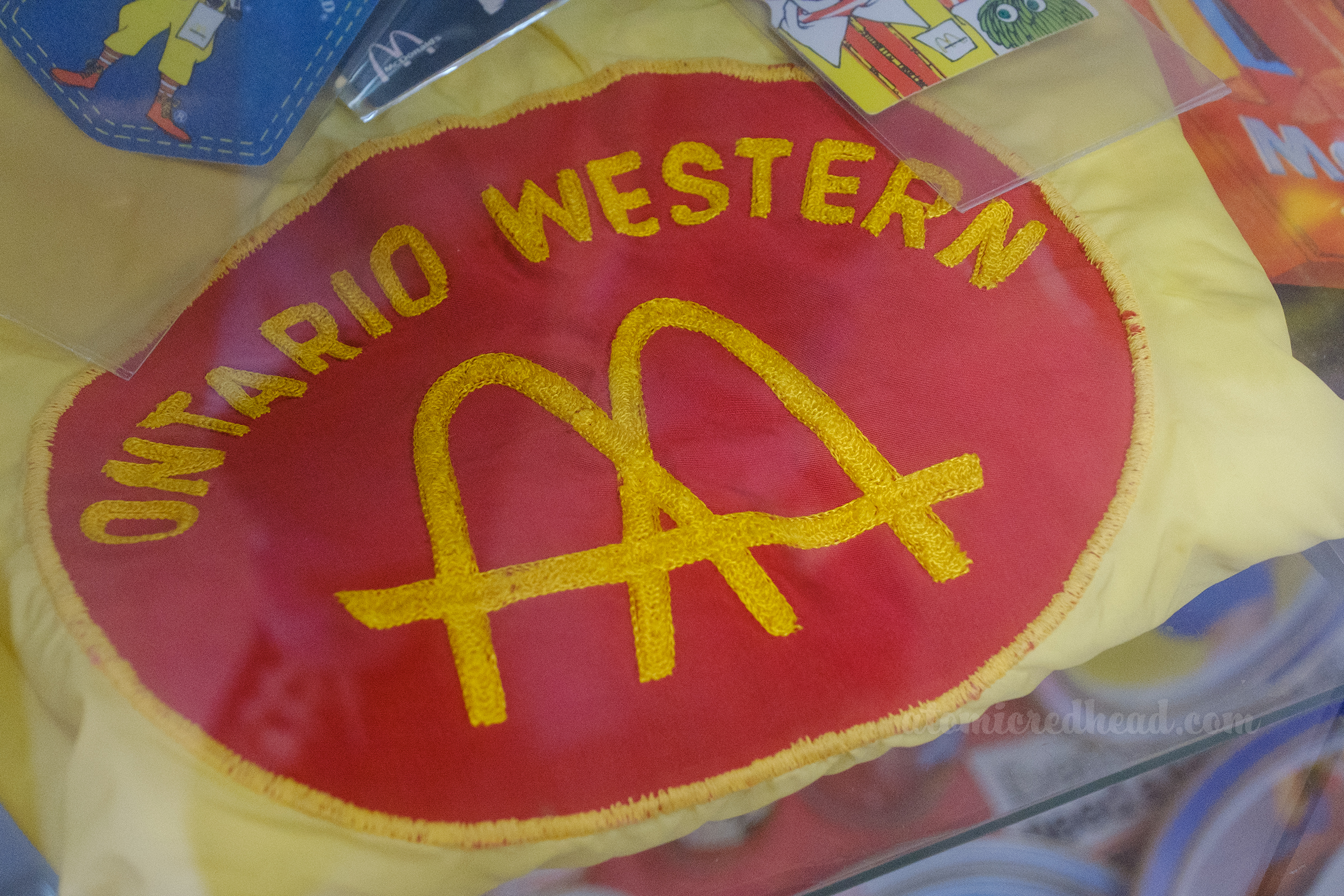 A chain stitched employee shirt features the original Golden Arches design and reading "Ontario Western"