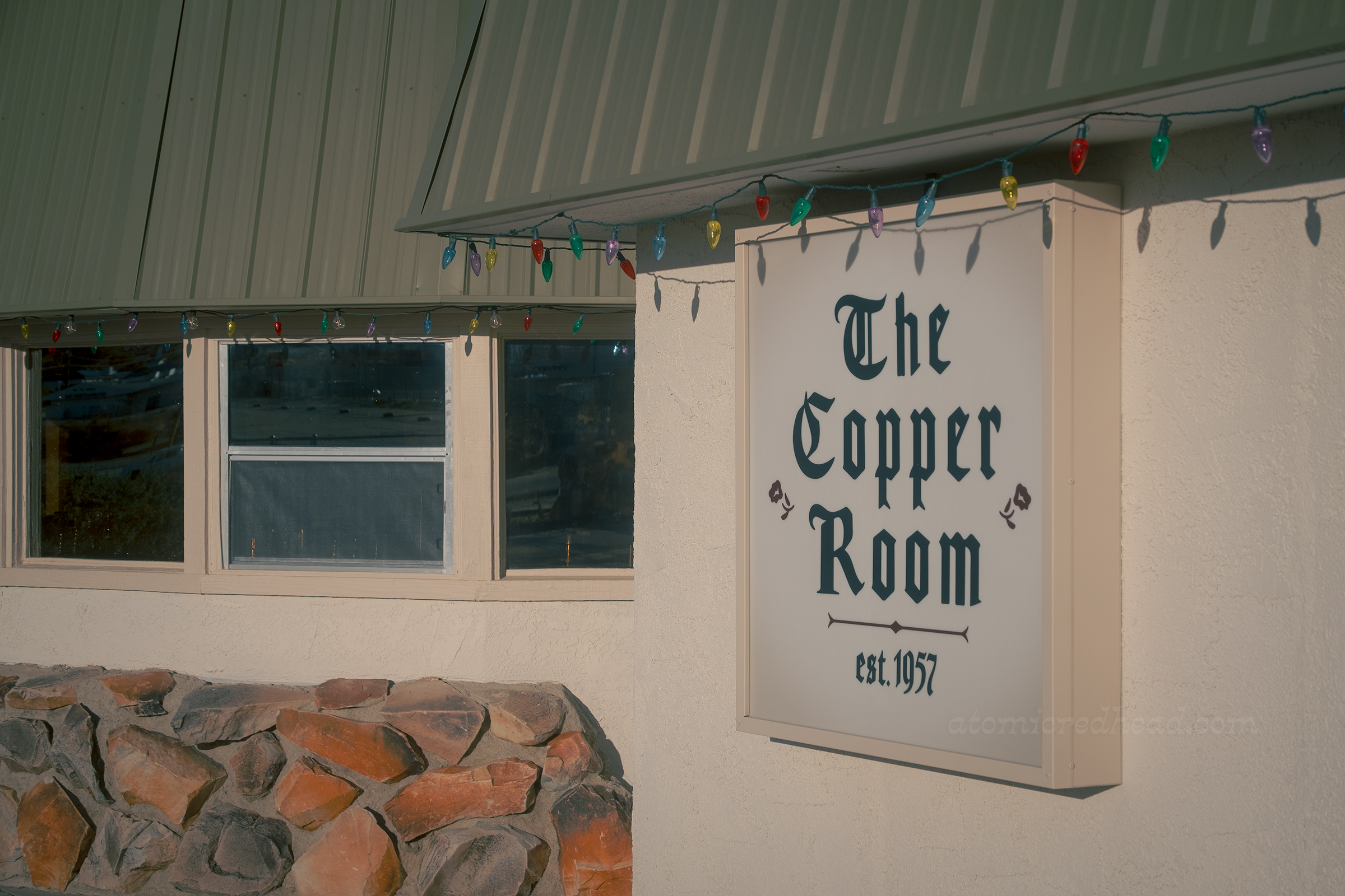 Close-up of the sign reading "The Copper Room est. 1957" in gothic script.