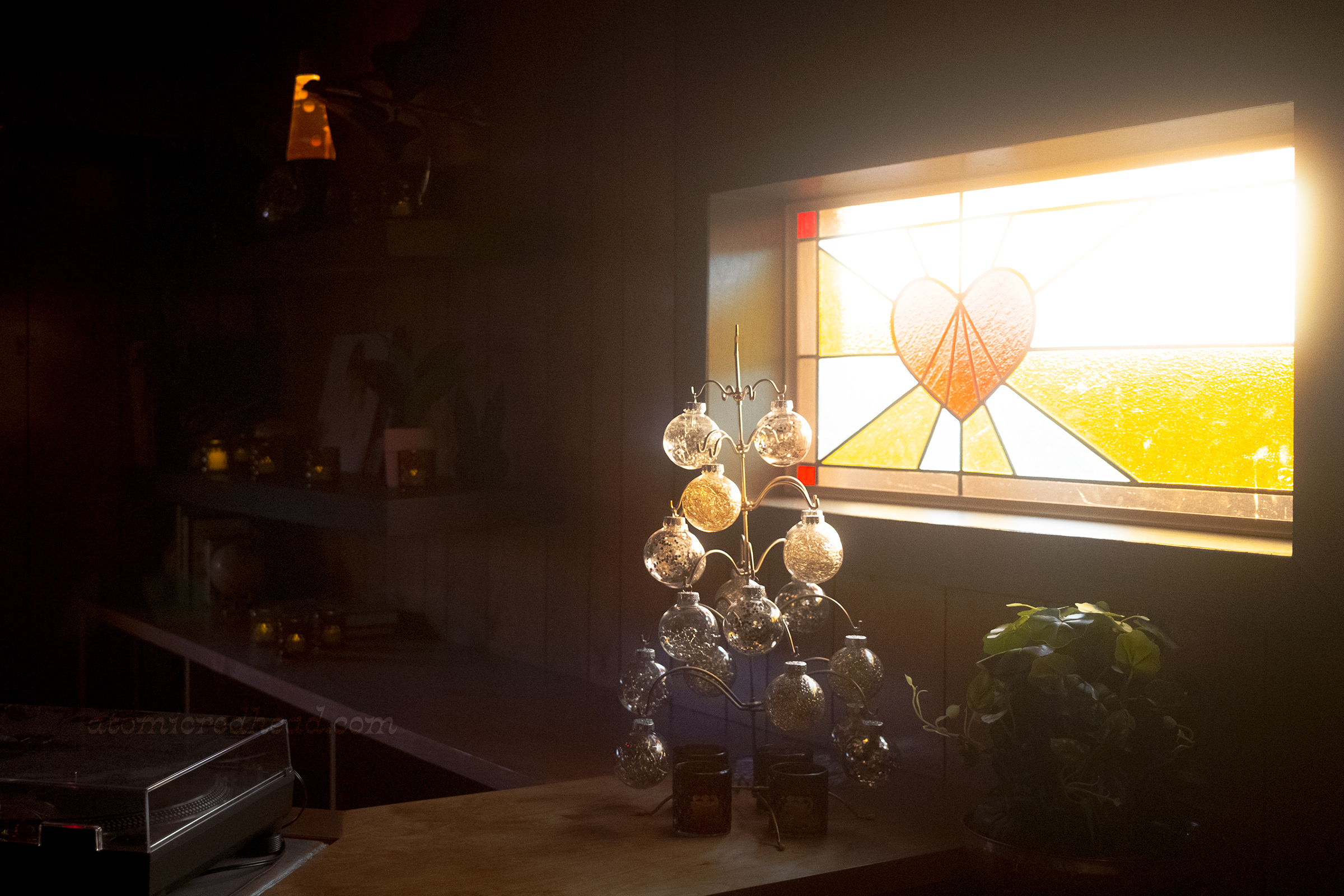 Close-up of a stained glass window of a heart.