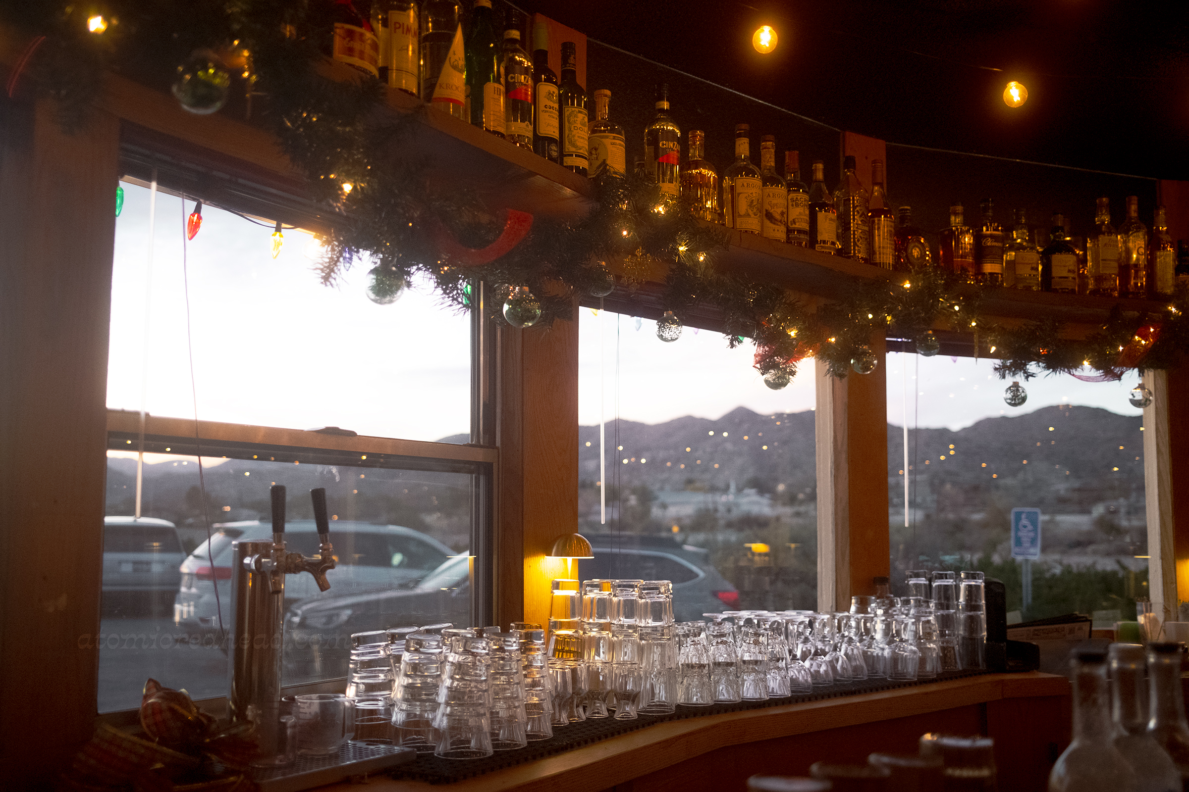 The bar, which features windows looking west and the sunset.