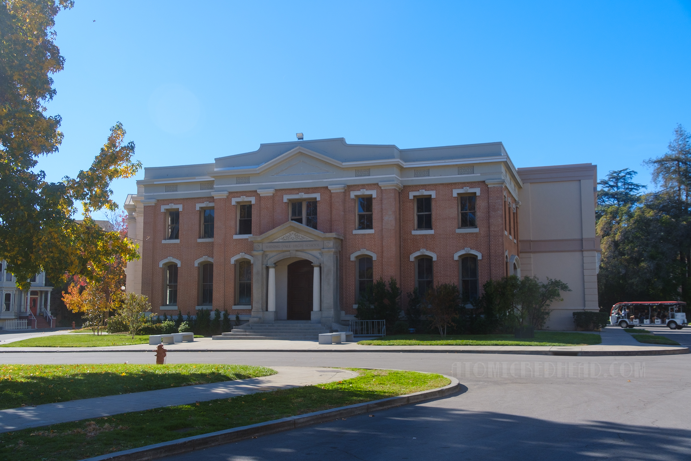 A large two story brick building that can serve as a school, like it did in Gilmore Girls, or as a City Hall or courthouse style civic building.