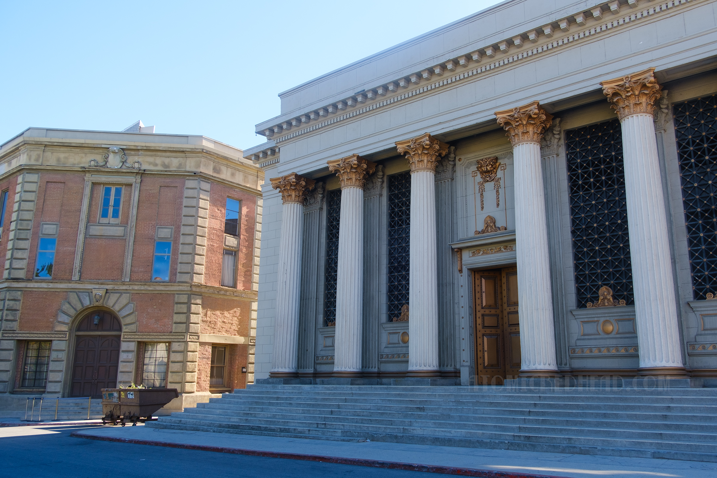 A stone building with towering Roman style columns out front which served as Gotham City Police Headquarters in the 60s Batman series.