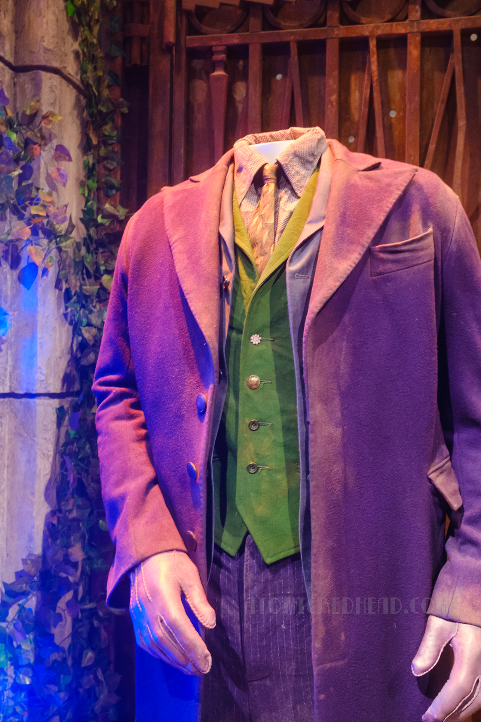 Heath Ledger's Joker costume from The Dark Knight, which features a purple overcoat, purple pinstripe pants, purple patterned shirt, and green vest.