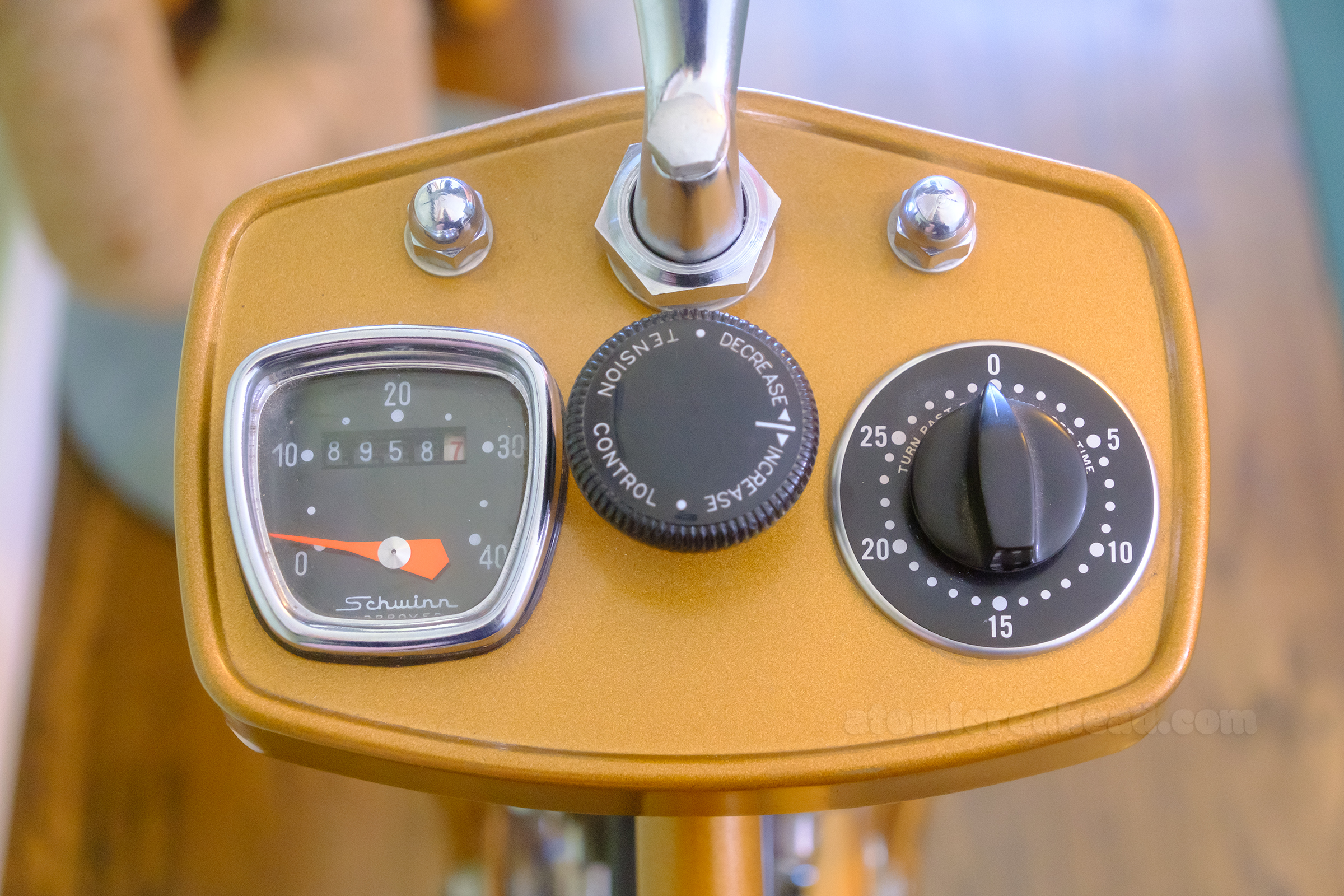Close-up of the bike's speedometer, tension dial, and timer. 
