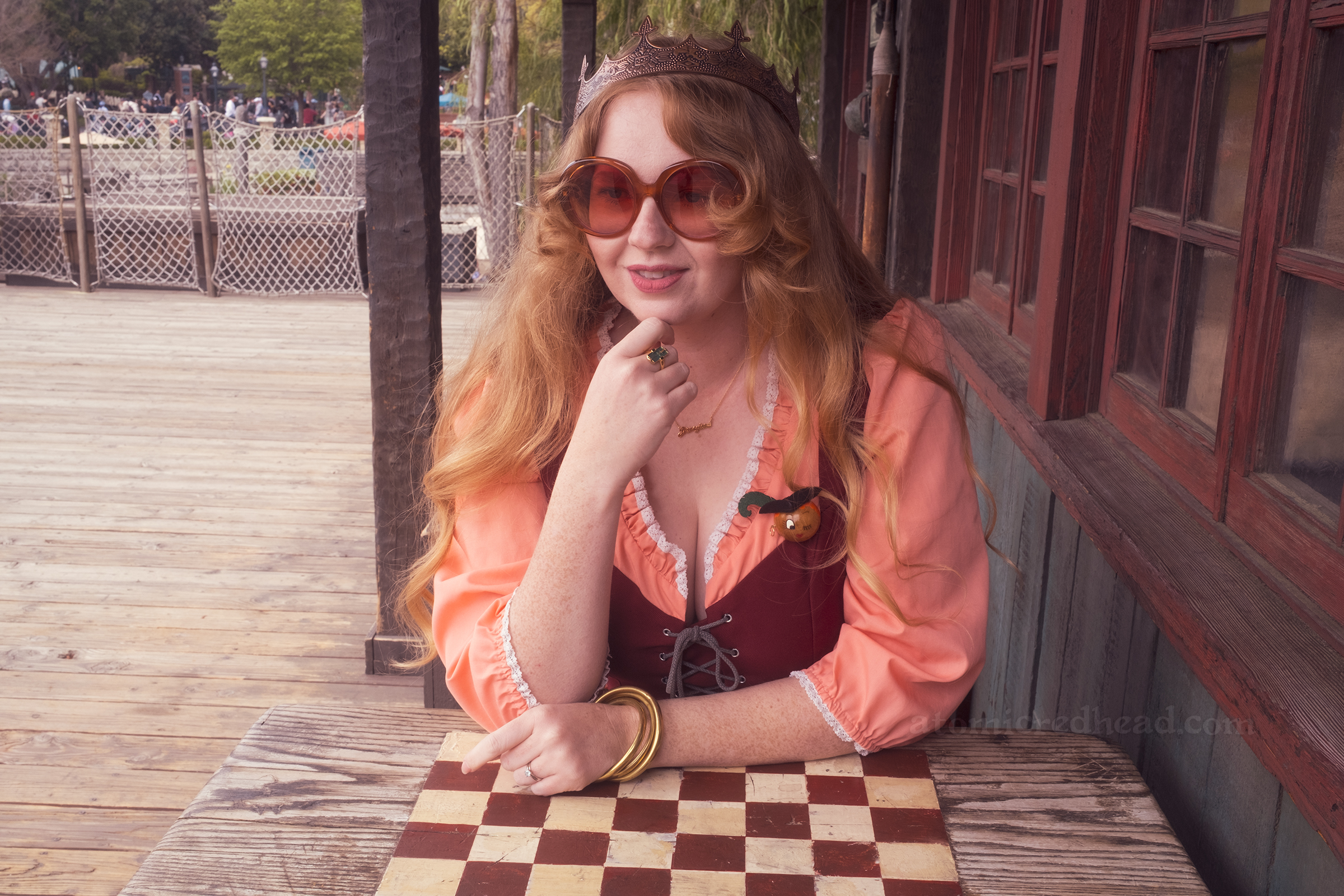 Myself seated at a table with a checkerboard painted on top.