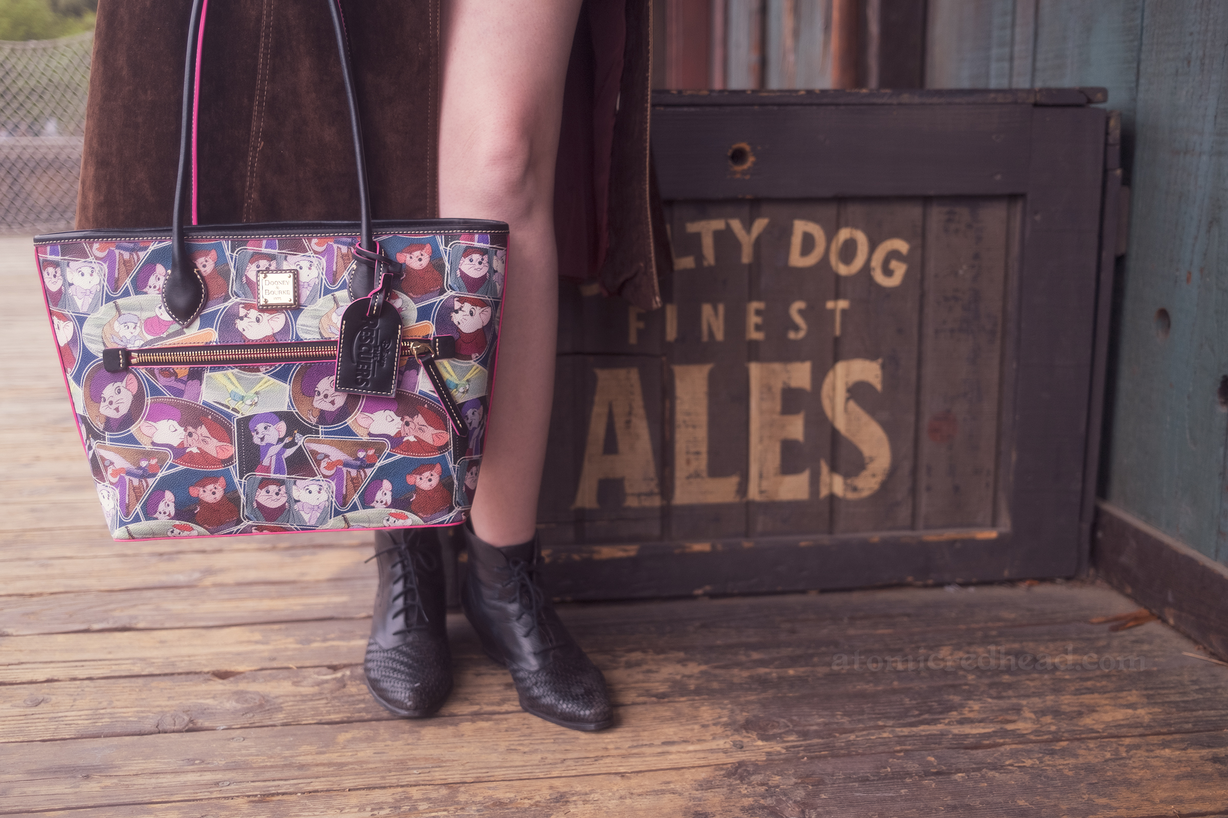 Close-up of my Rescuers purse, which features images of the mice Bernard and Bianca, as well as Orville the seagull and Evinrude the dragonfly.