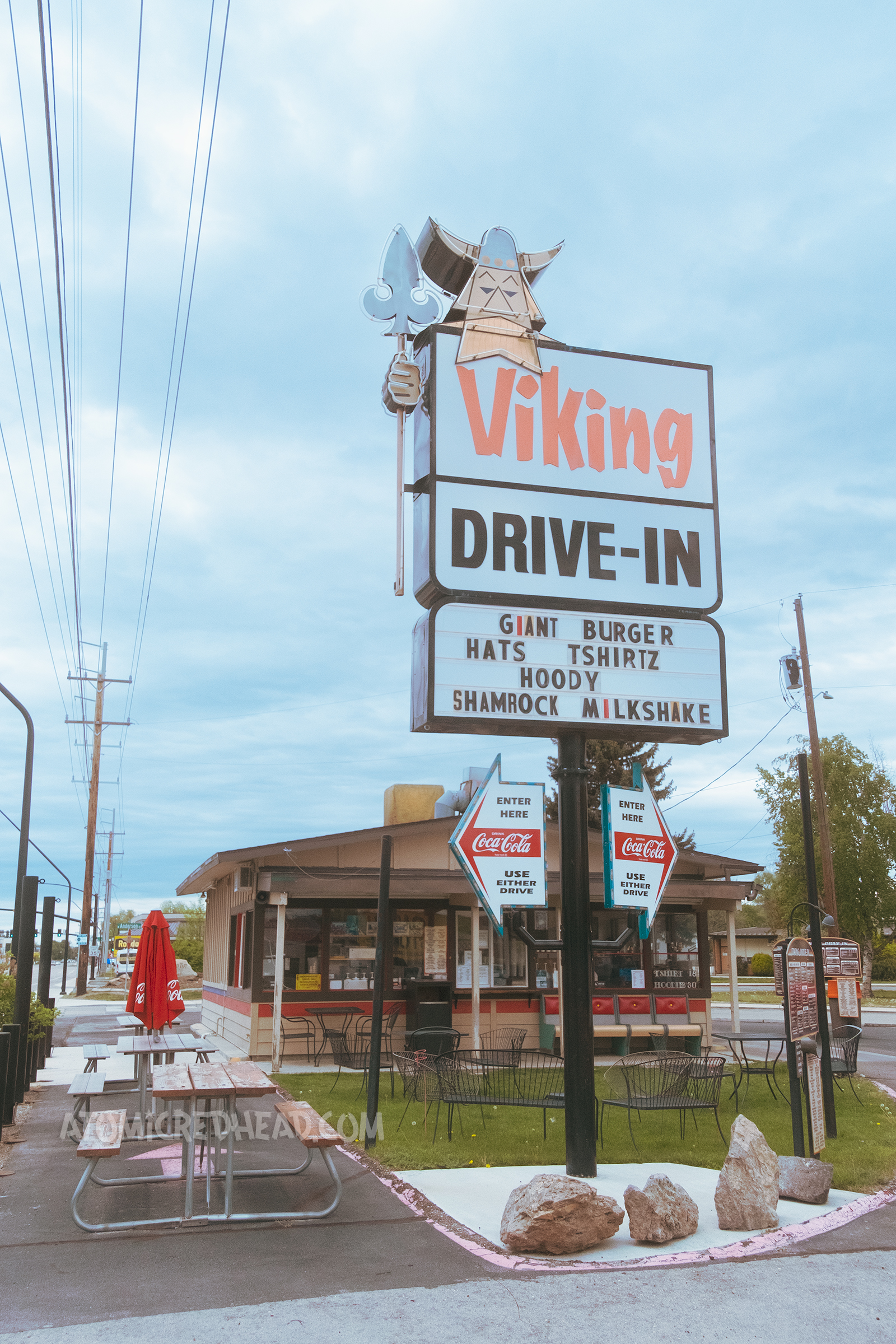 A combination neon and backlit plastic sign reads "Viking Drive-in" and features a Viking man with a spear.
