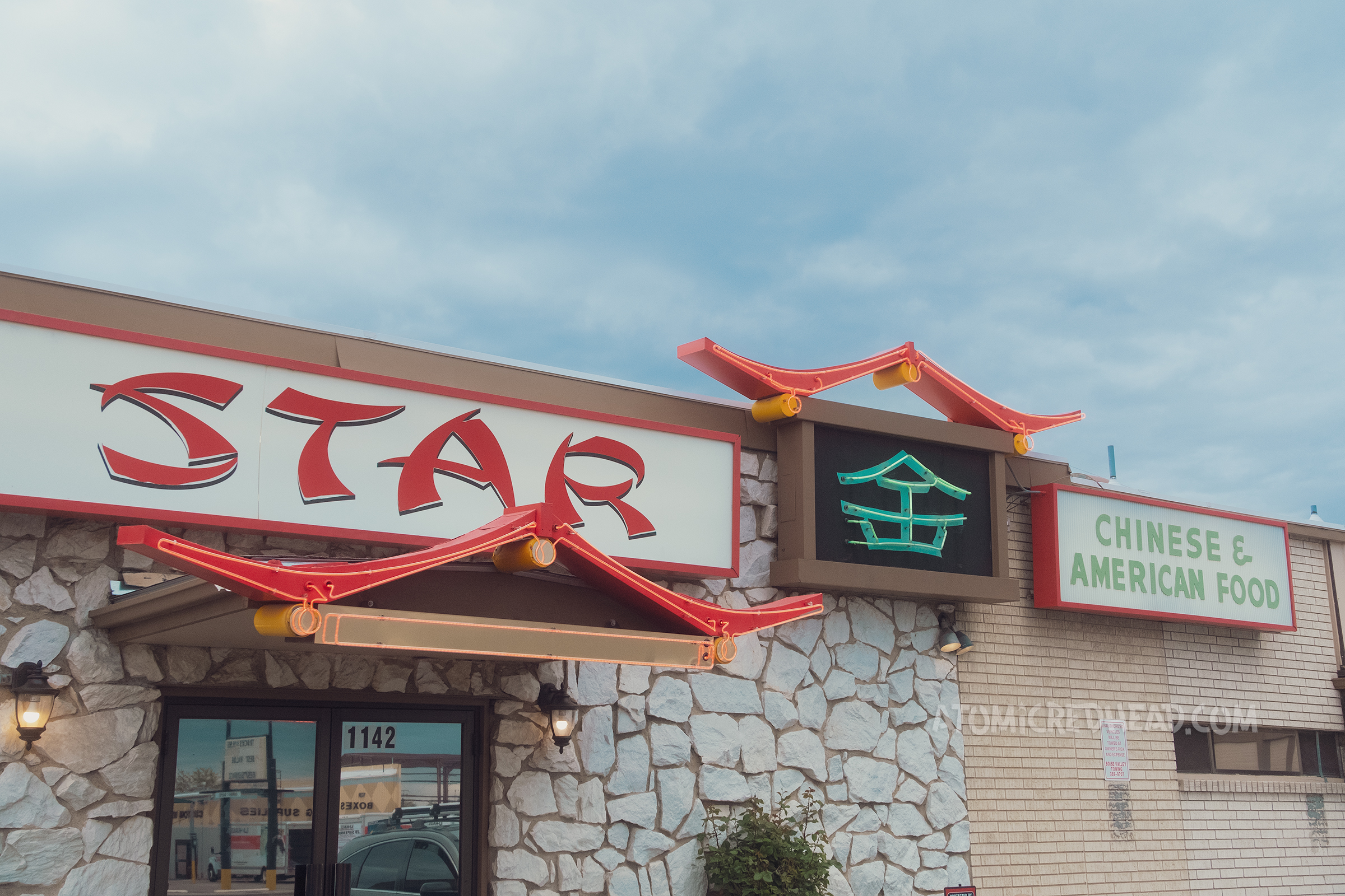 A combination backlit plastic and neon sign grouping reading "Star" and "Chinese & American Food"