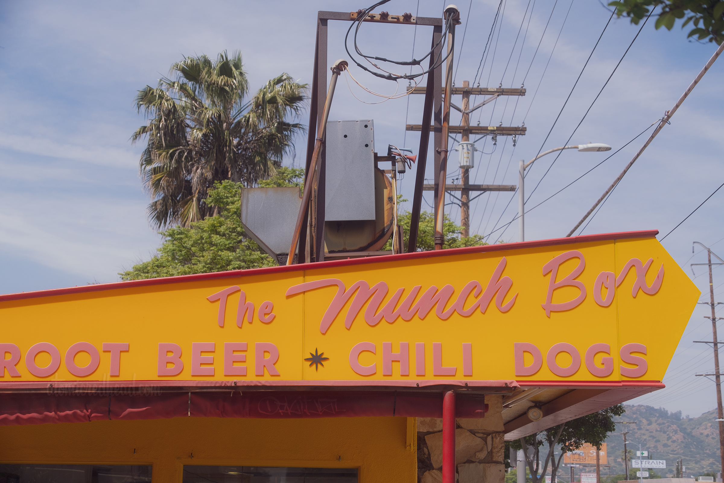 The side roof of The Munch Box, which reads "The Munch Bod Root Beer Chili Dogs"