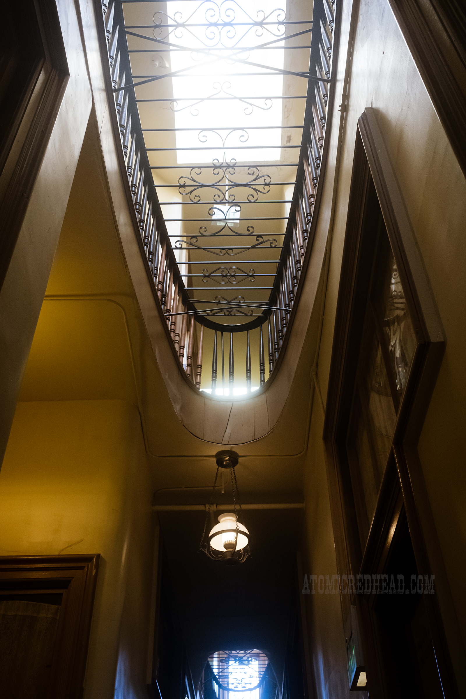 The second floor opens up to look over the lower floor with a grate over the opening. 