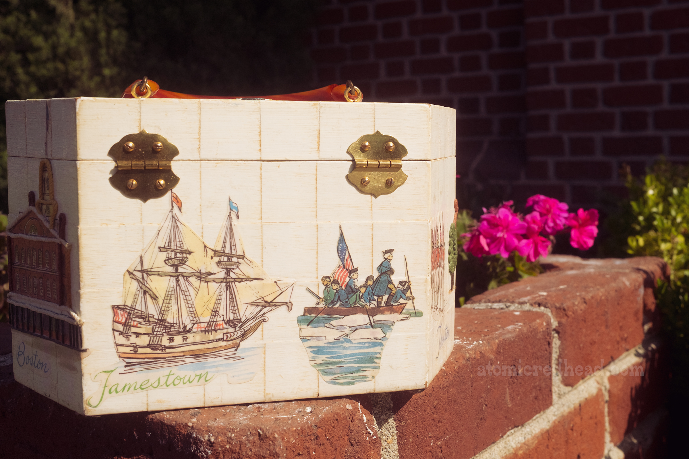 Close-up of my purse, which is a box, then decoupaged with images of the American Revolution, including a ship, and Washington crossing the Delaware.