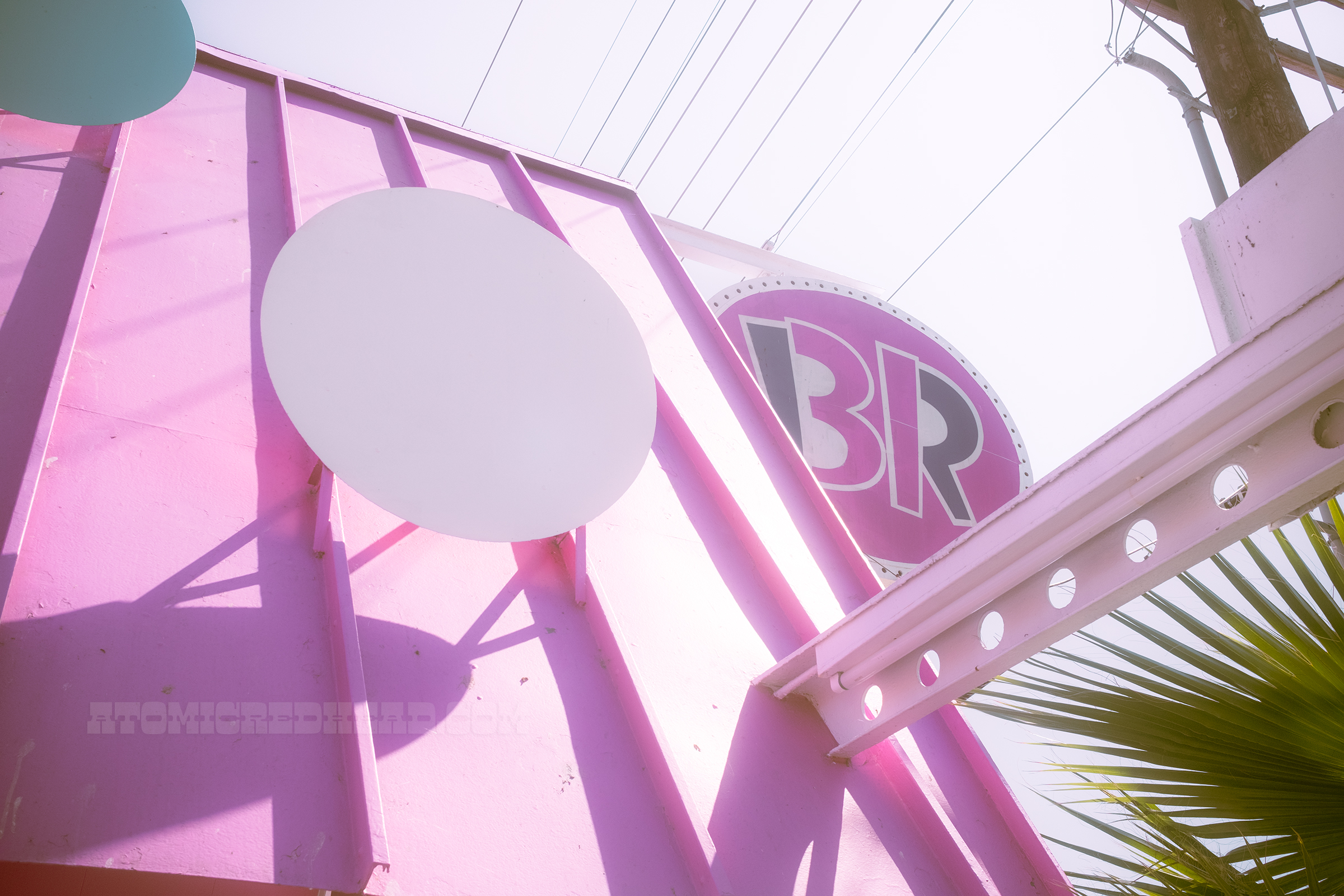 Close-up of the dots on the roof which are raised from the roof, across the front is a white beam with circles cut out.