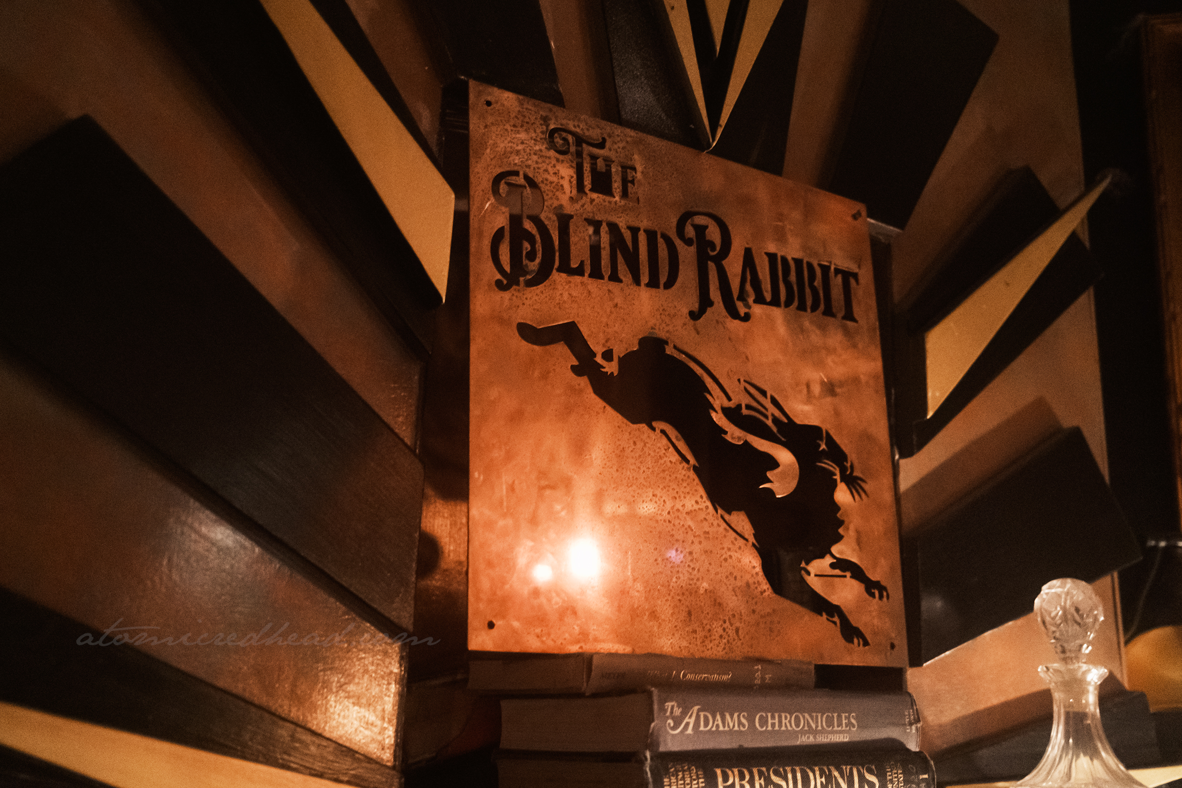 Gold sign inside, featuring a leaping rabbit, and text reading "The Blind Rabbit"