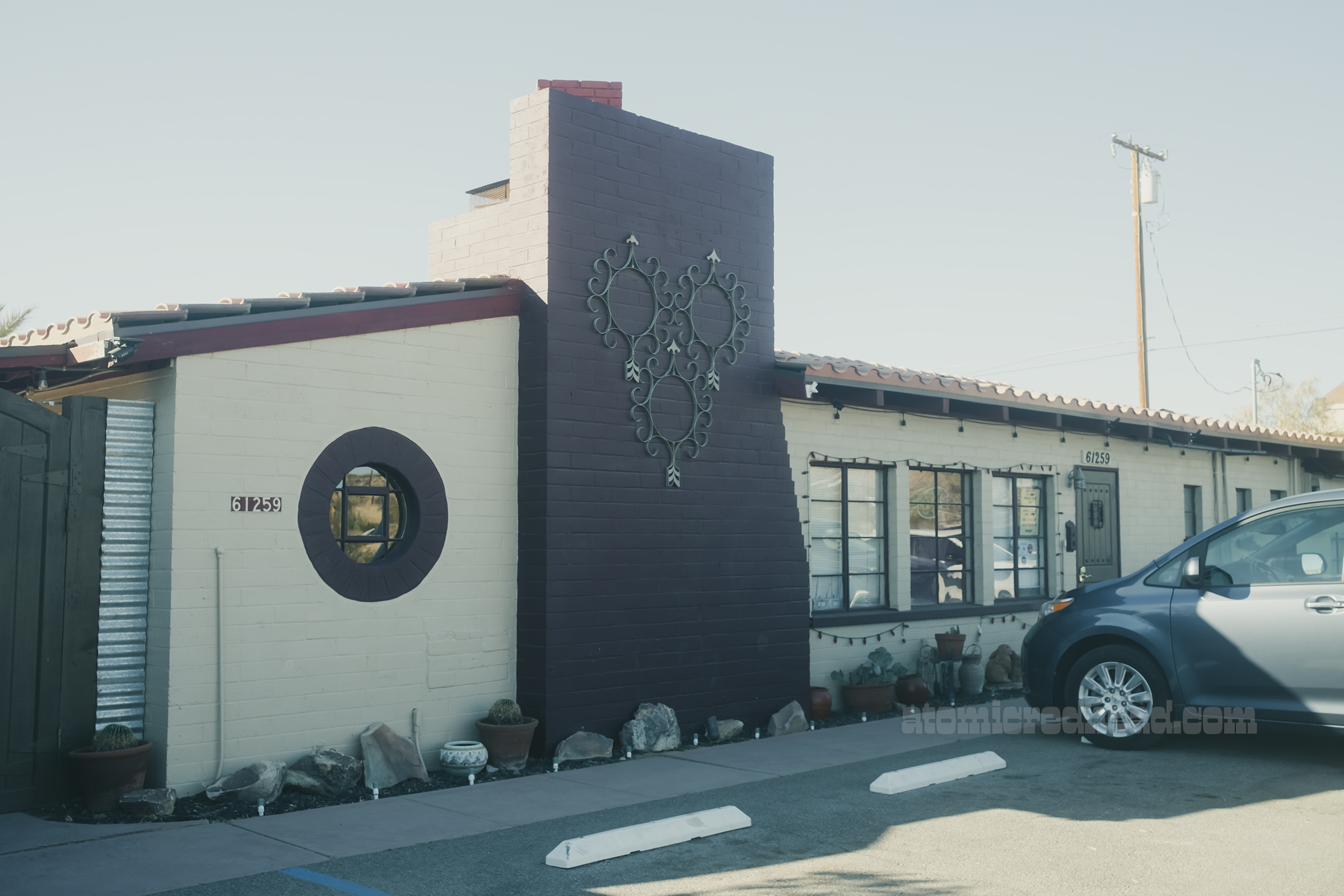 Exterior of the Inn, with a cream and maroon color scheme.