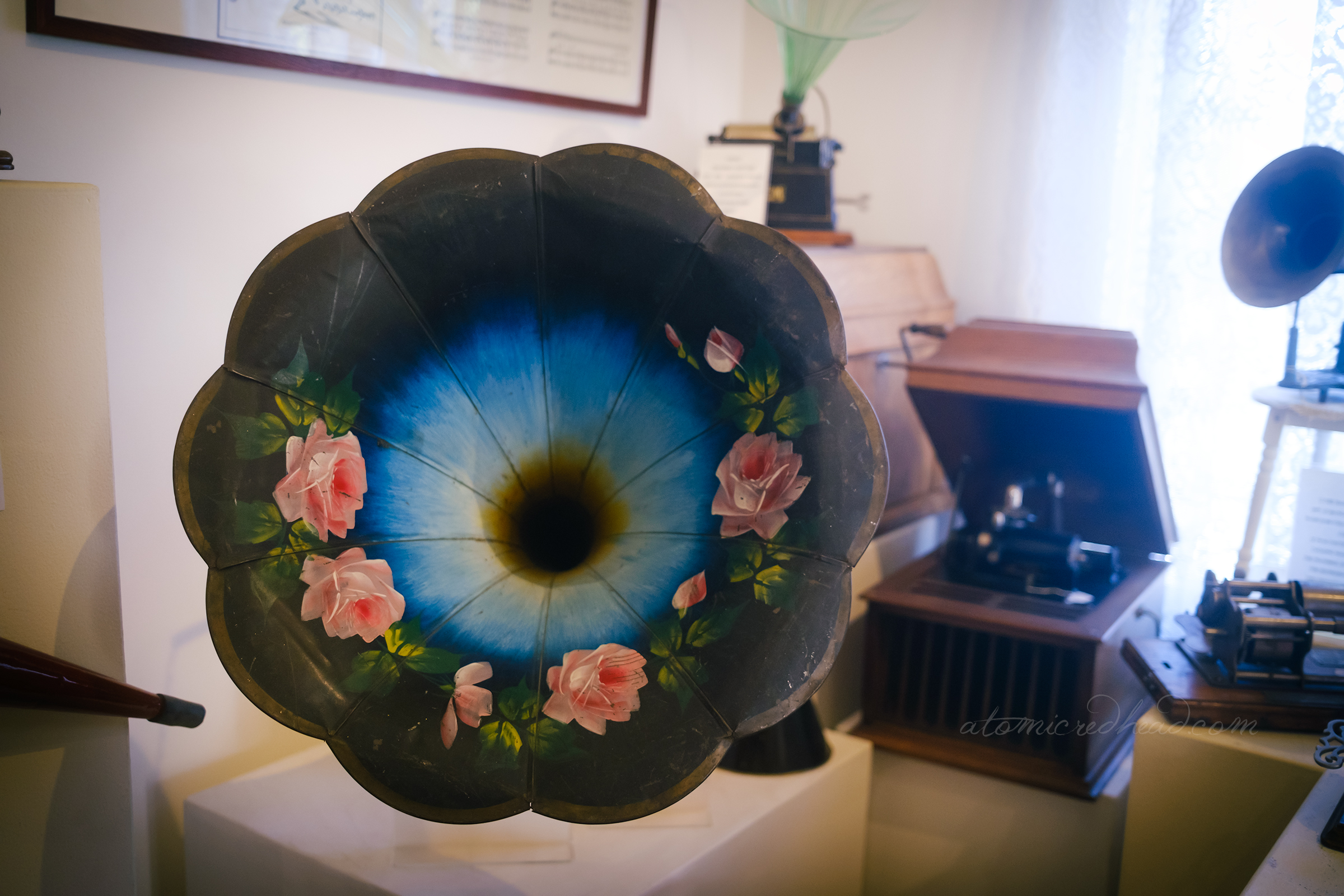 A painted phonograph with pink roses.