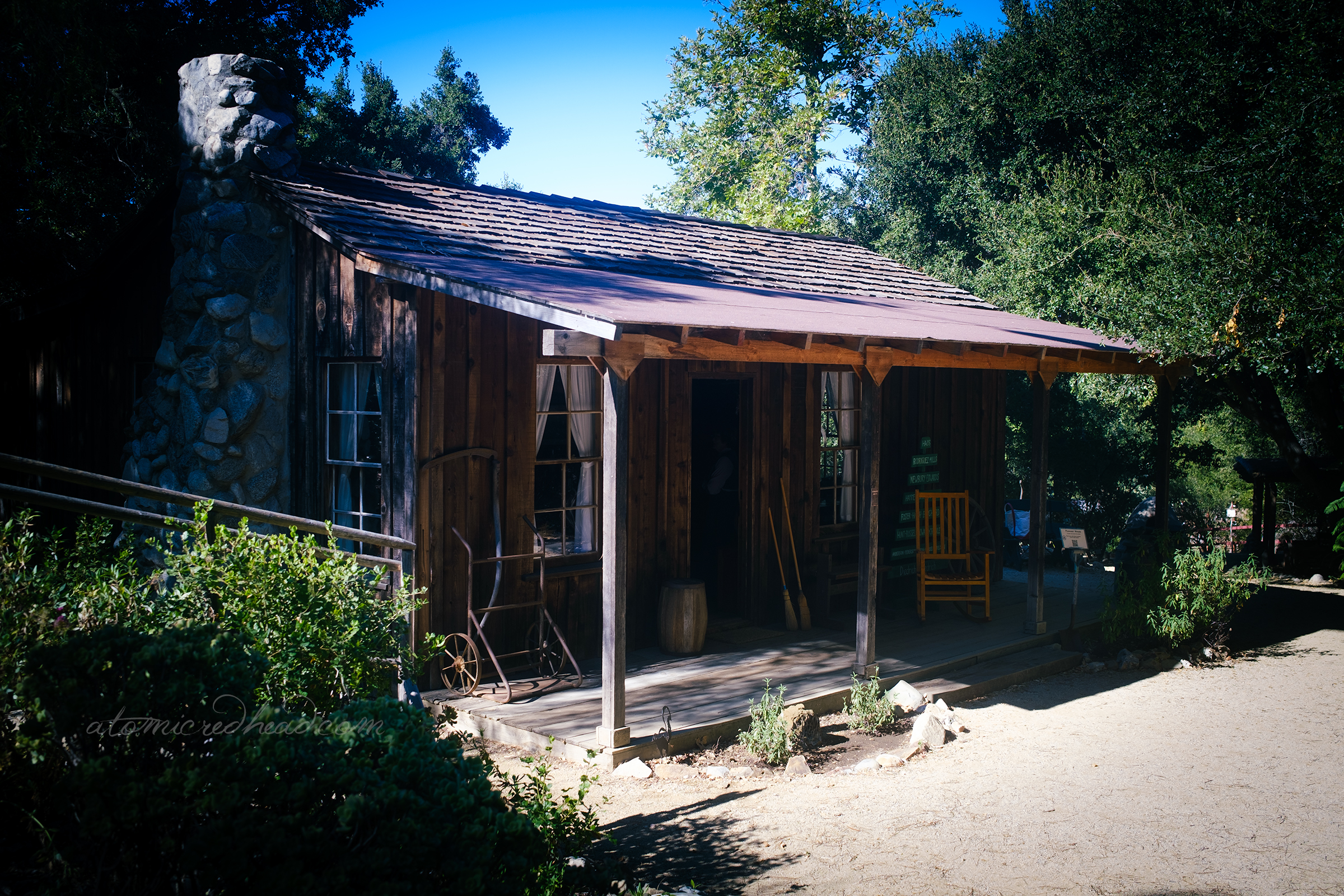 Exterior view of a small simple cabin.