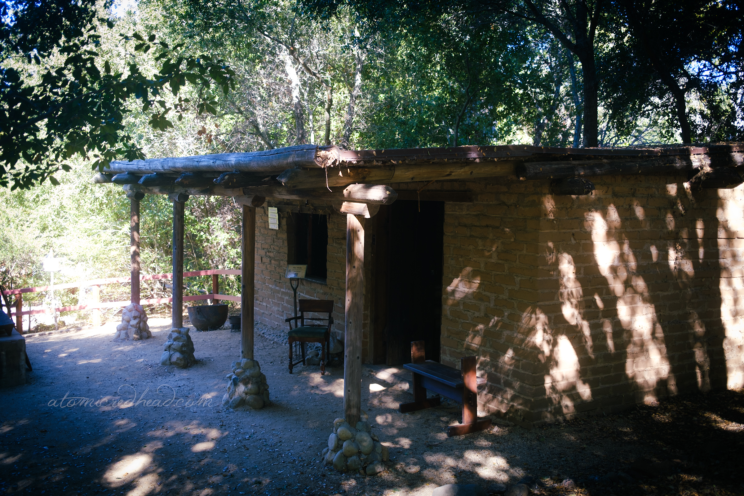 Exterior view of a simple adobe brick structure.