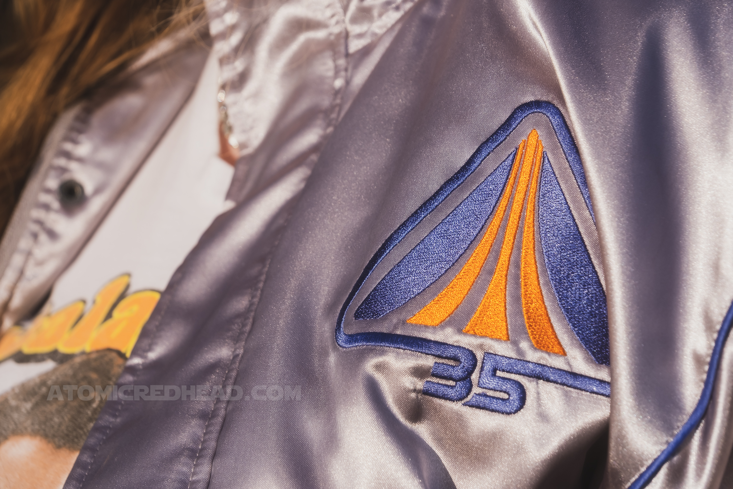 Close-up of the front of my jacket, which features the Star Tours logo and "35" in orange and blue emboridery.