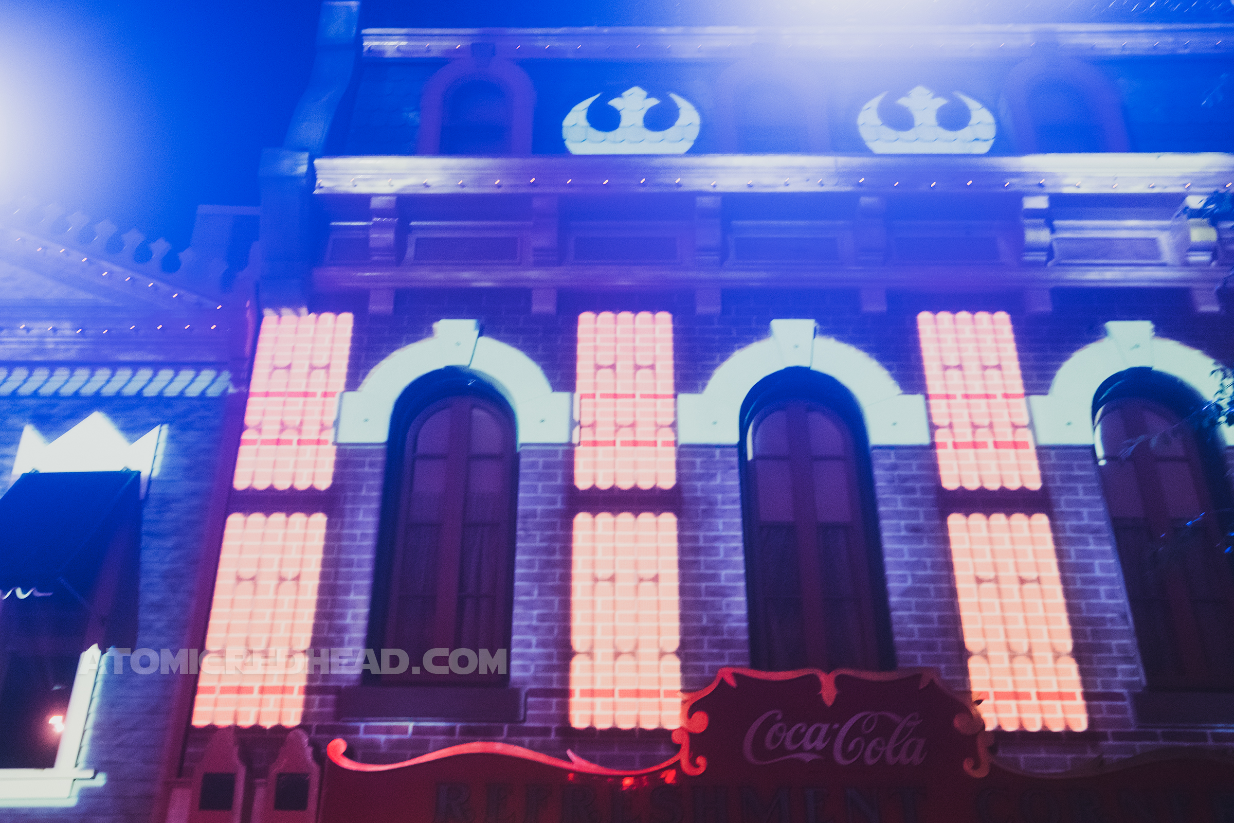Projections on Main Street buildings give them a space feel and feature the symbol of the Rebellion.