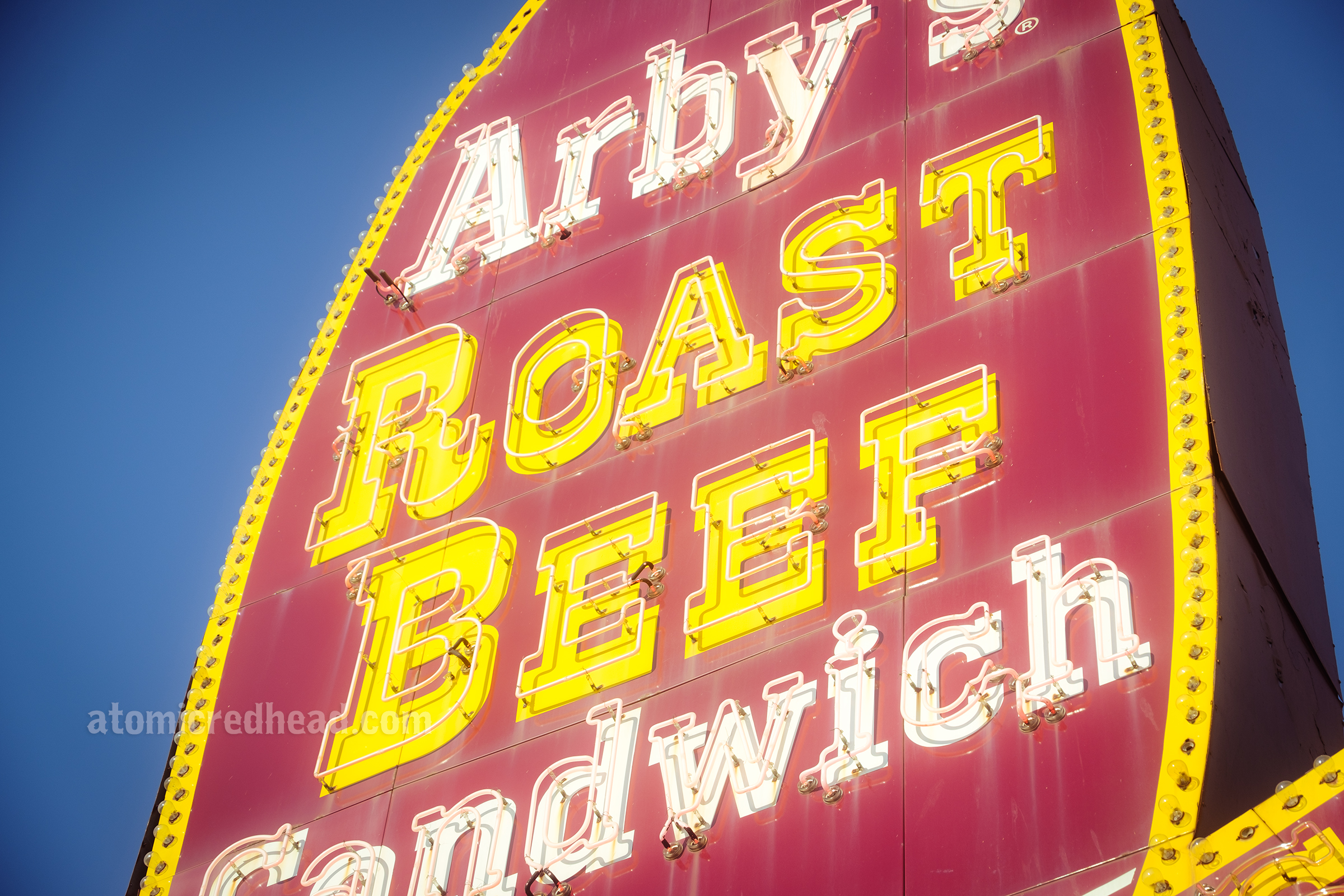 Extreme close up of the yellow letters spelling out "Roast Beef"