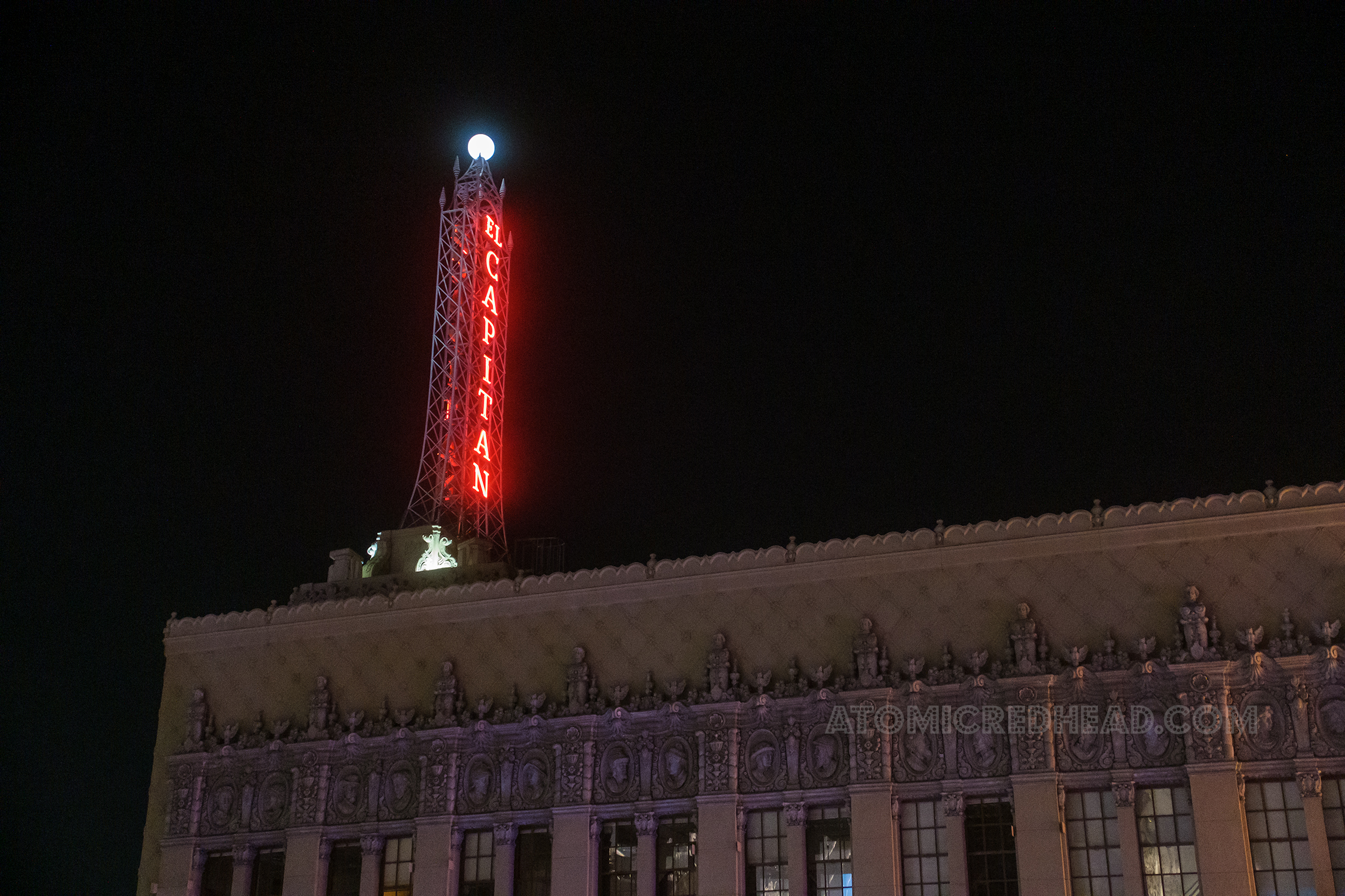 View of the tower atop the roof that reads "El Capitan" in red neon.