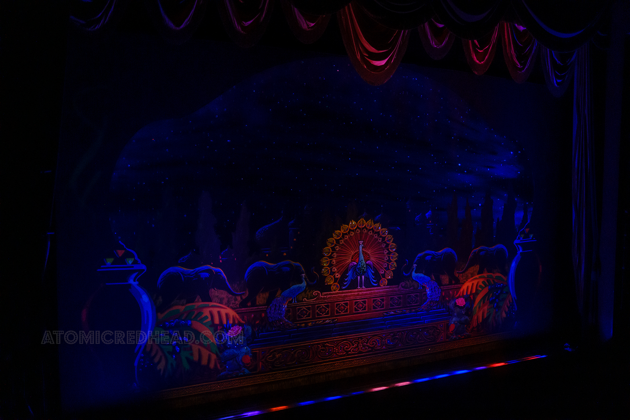 A large peacock and elephants make up the curtain preshow.