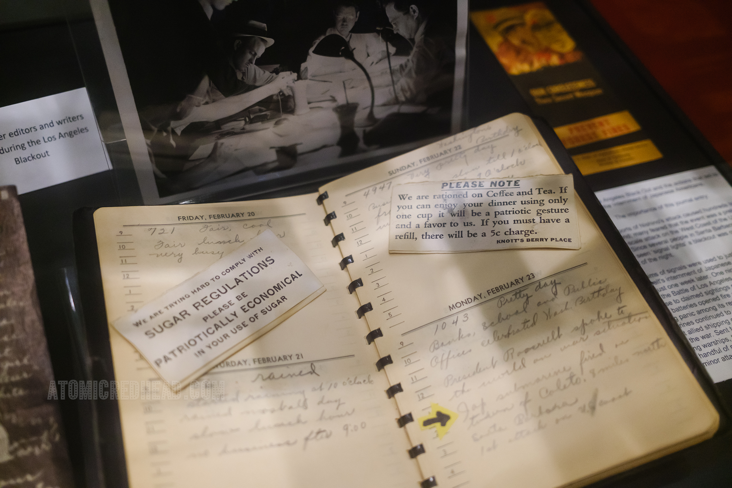 A datebook from Knott's Berry Farm noting a Japanese attack during World War II, along with table notes reading "We are trying hard to comply with sugar regulations please be patriotically economical in your use of sugar" and "Please note we are rationed on Coffee and Tea. If you can enjoy your dinner using only one cup it would be a patriotic gesture and a favor to us. If you must have a refill, there will be a 5c charge. Knott's Berry Place."