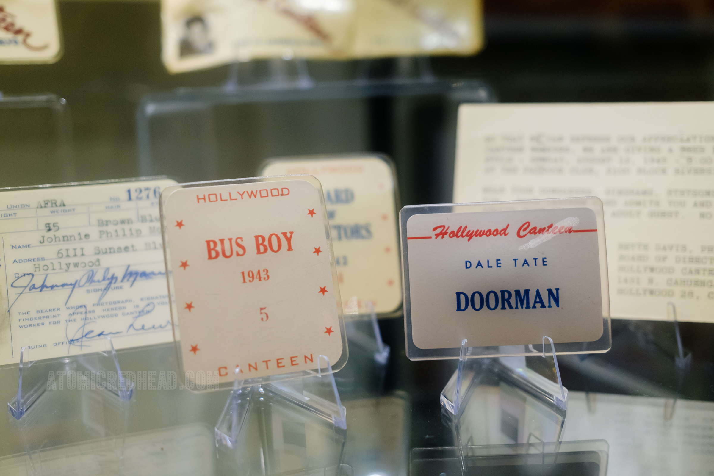 Various forms of identification for the Hollywood Canteen, including a red and white one for a bus boy, and a red white and blue one reading "Dale Tate Doorman"