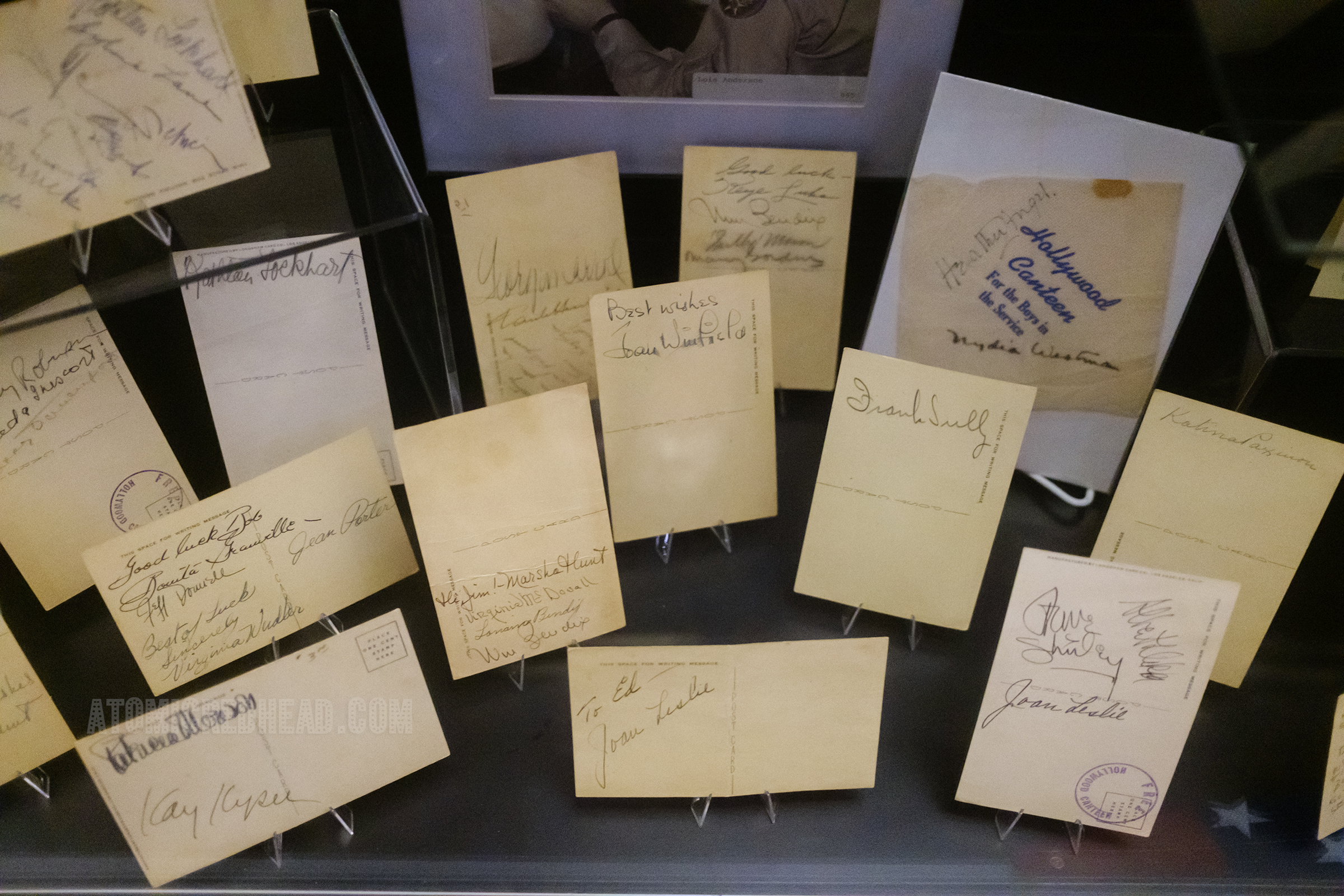 A collection of postcards featuring autographs from the various celebrities that visited the canteen.