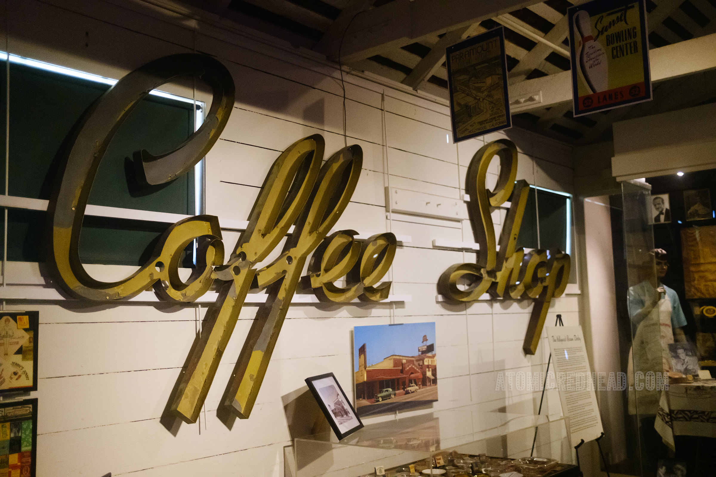 Large metal letters that once housed neon reads "Coffee Shop"