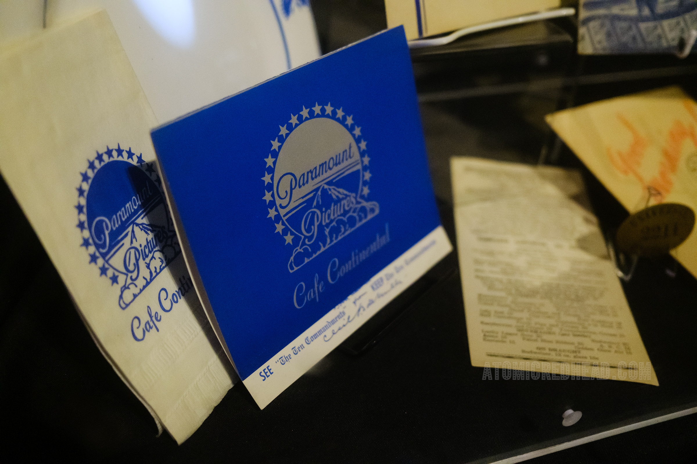 Menu for Paramount Pictures Cafe Continental, blue with grey detail and the logo of the Paramount mountain.