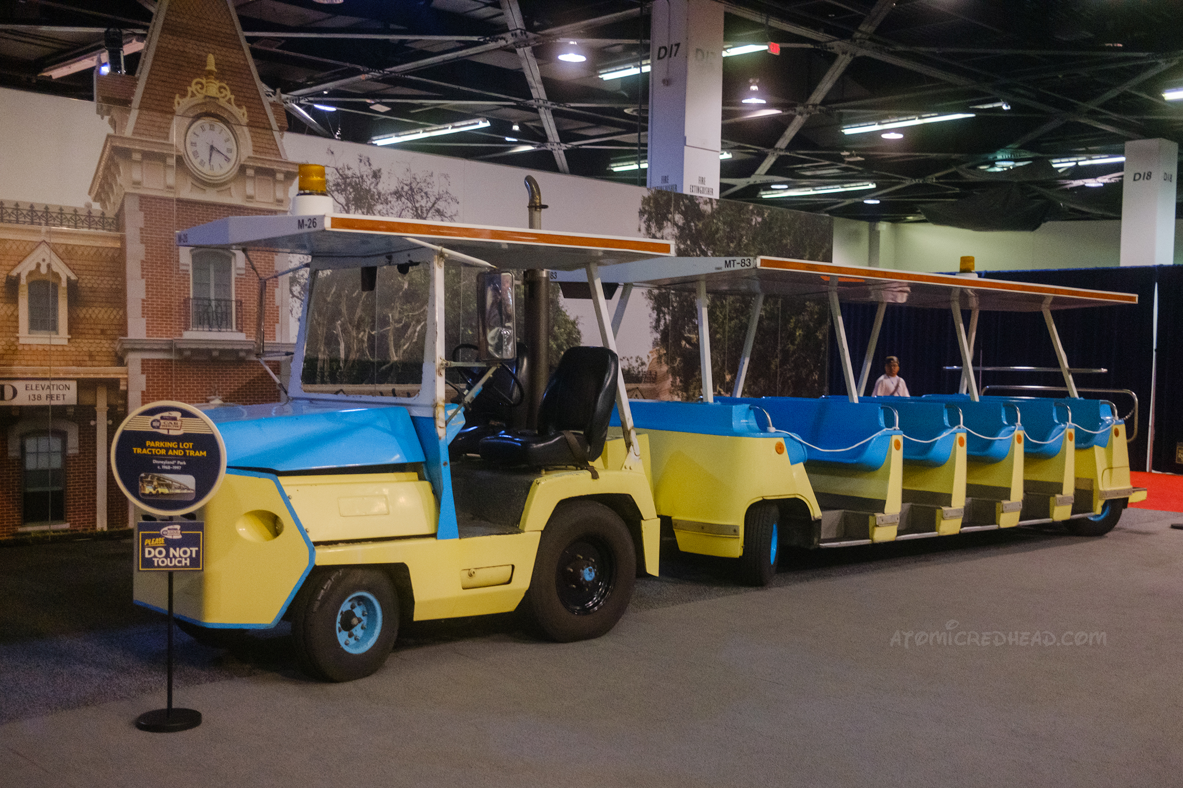A blue and yellow tram, once used to carry Disneyland guests.