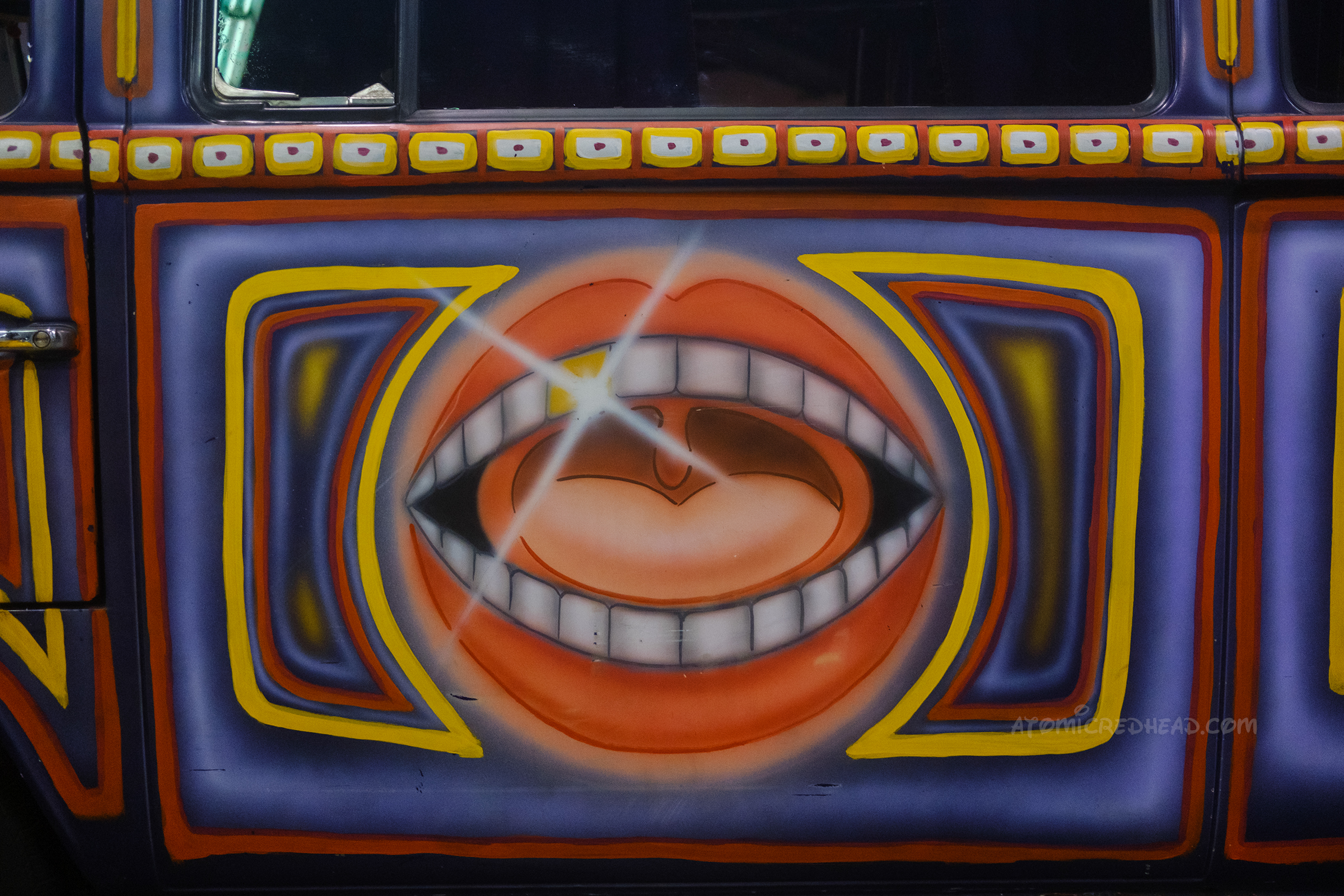 Close-up of an open mouth painted on the side of a Volkswagen bus used in The Muppets Mayhem.