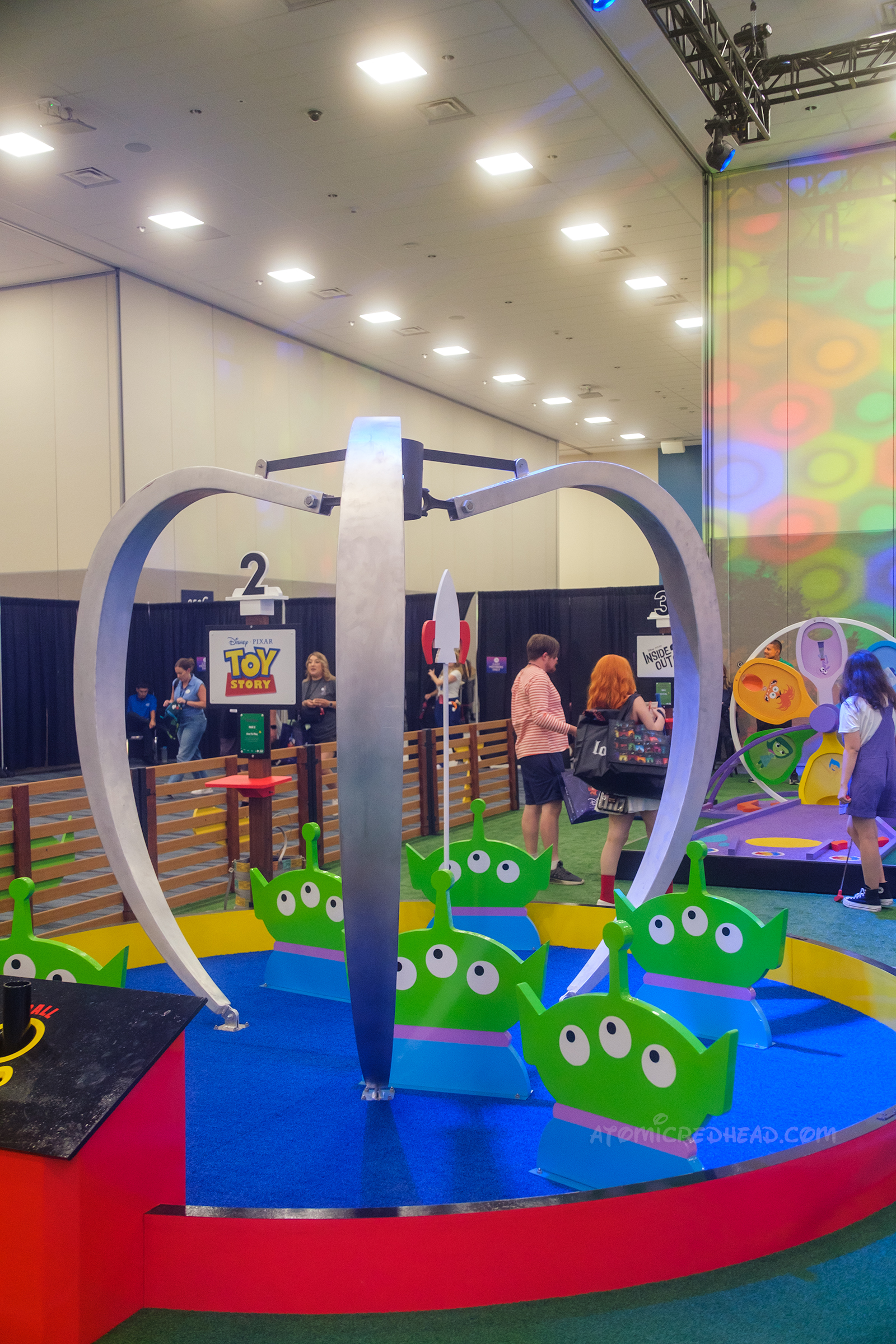 A hole that is made to look like The Claw with the aliens from Toy Story.