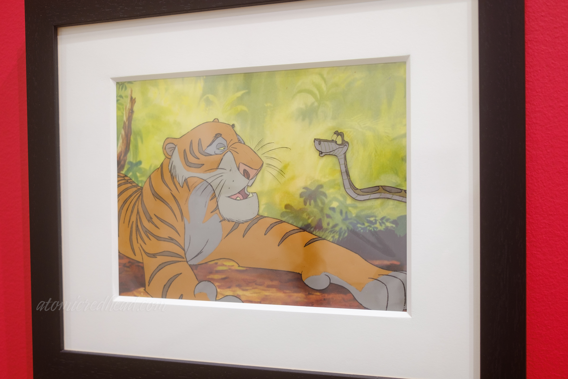 Animation cel from The Jungle Book featuring the tiger Shere Kahn and the snake Kaa.