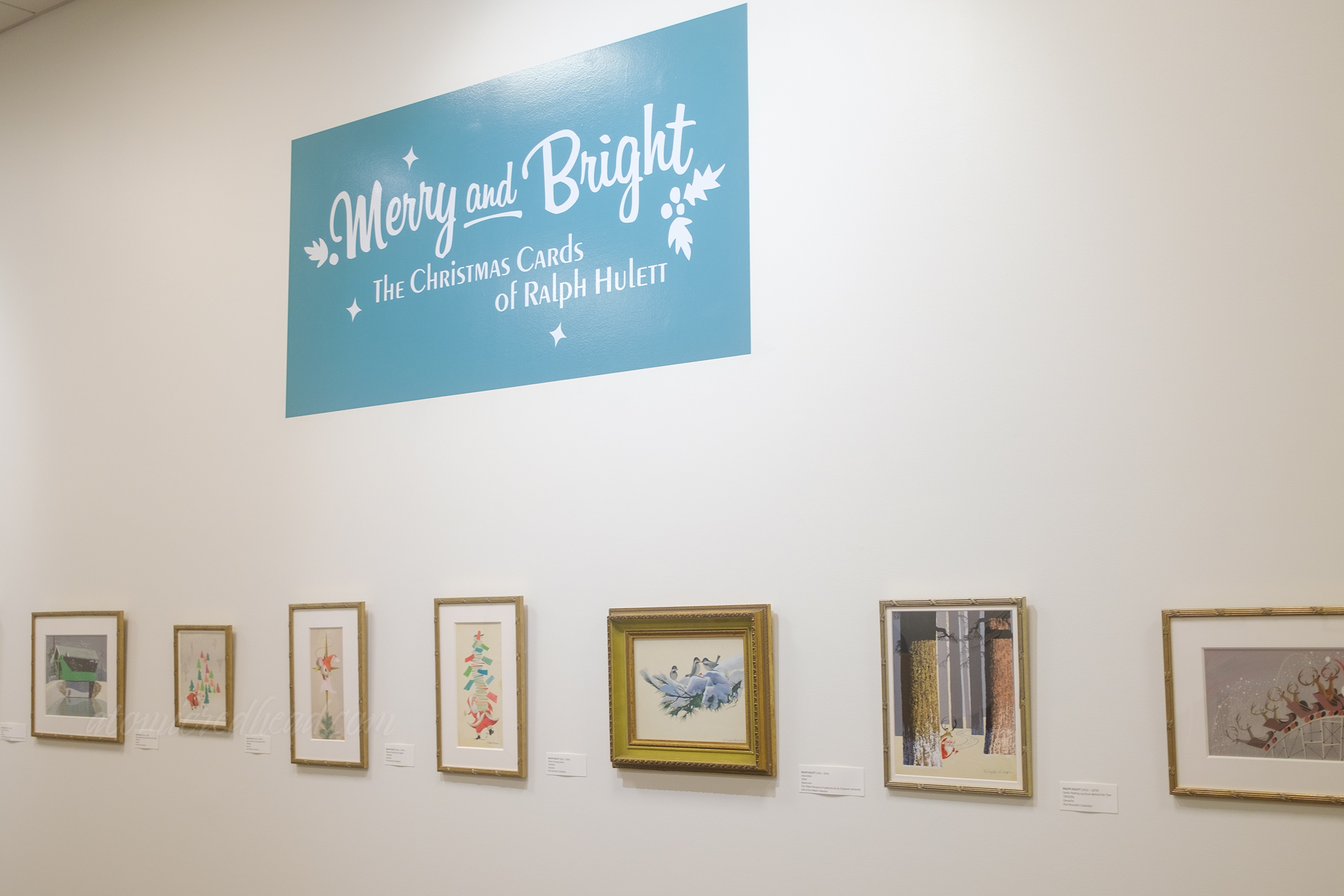 Overall of the area dedicated to Ralph Hulett's art, reading "Merry and Bright" across the top.