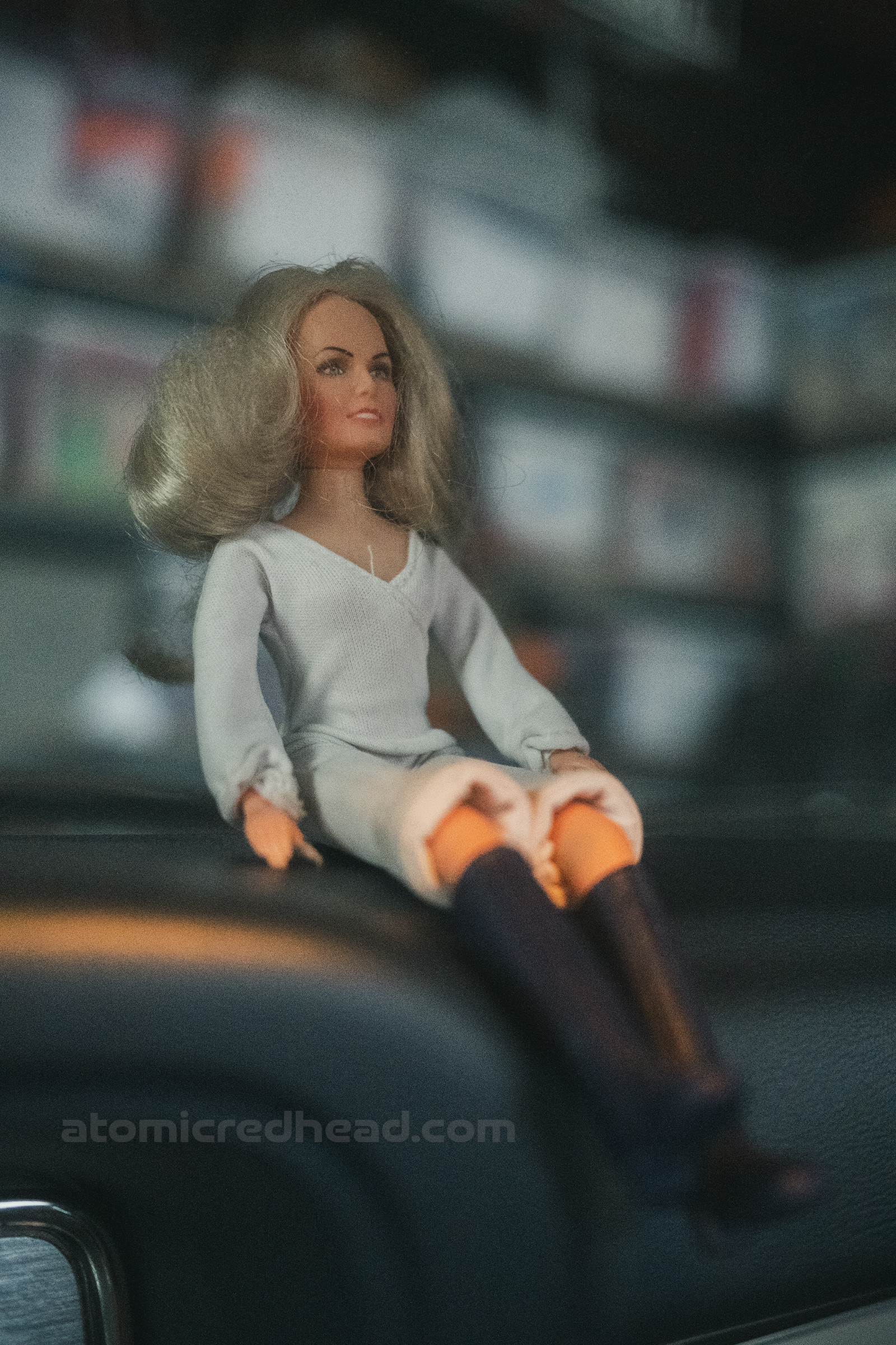 A doll of Farrah Fawcett sits on the dash.