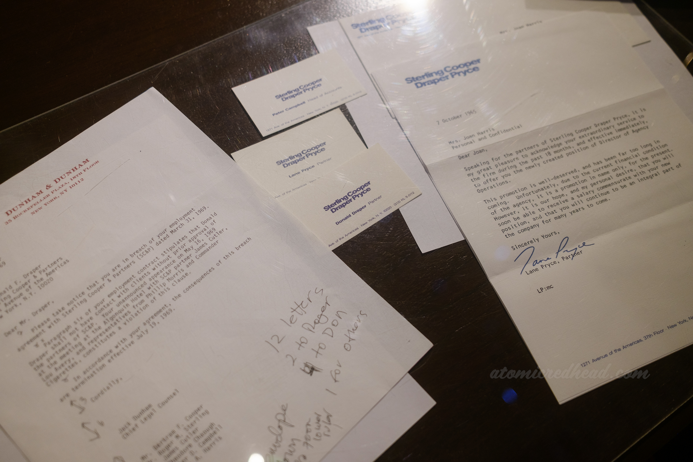 Various Sterling Cooper Draper Price papers on Joan's desk