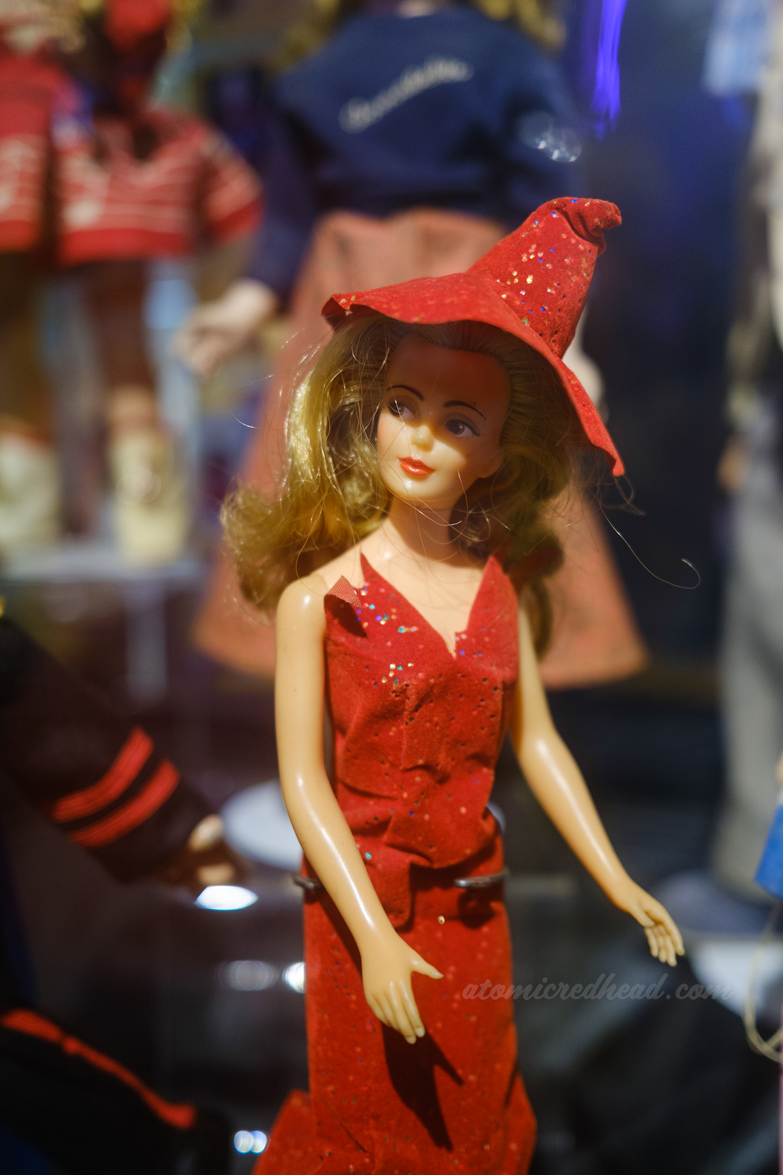 Samantha from Bewitched doll, wearing a red outfit with red witch hat.
