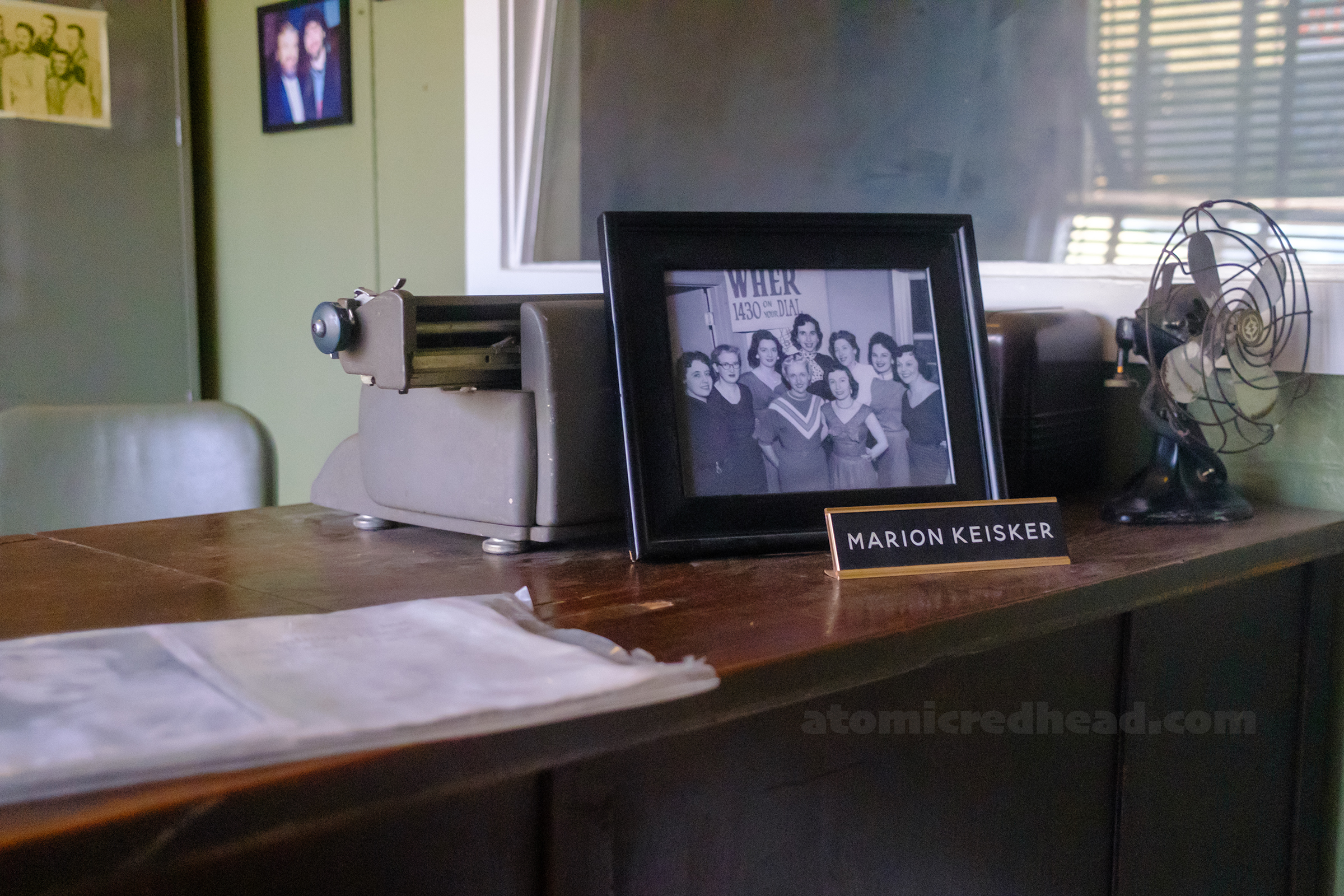 View of Marion's desk with a photo of her and her name plate "Marion Keisker"